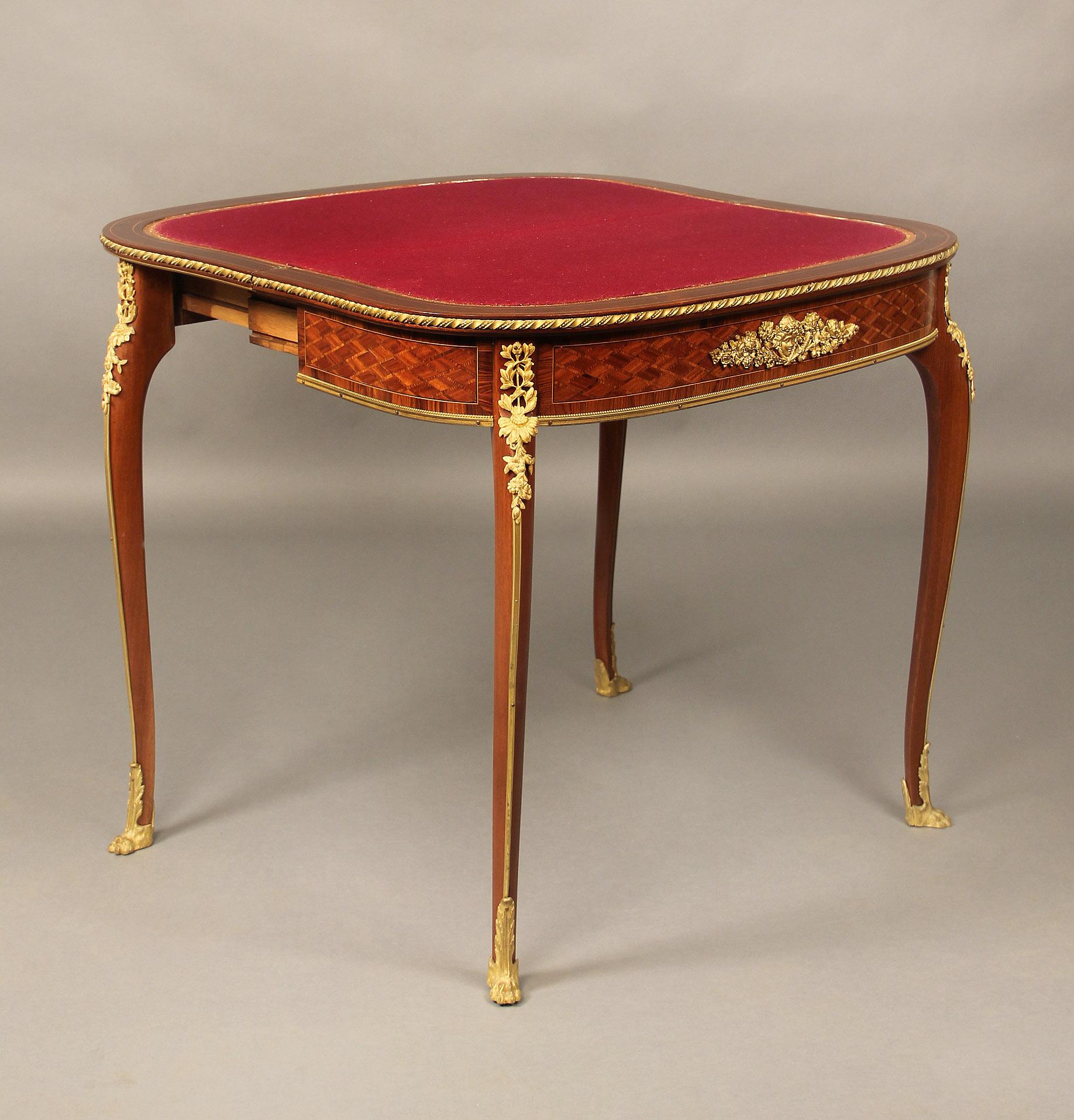 A late 19th century Louis XV style gilt bronze mounted mahogany, Kingwood and Satiné Parquetry card table

By François Linke

D-shaped hinged top with rope twist border opening up to reveal a felt lined playing surface, the front decorated with