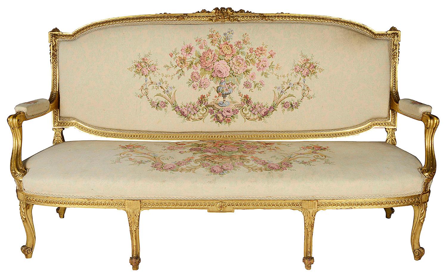 A good quality late 19th century carved giltwood Louis XVI style three-seat sofa, having scrolling motif and foliate decoration, tapestry upholstery and raised on elegant cabriole legs.

Batch 40 56726 UKETY