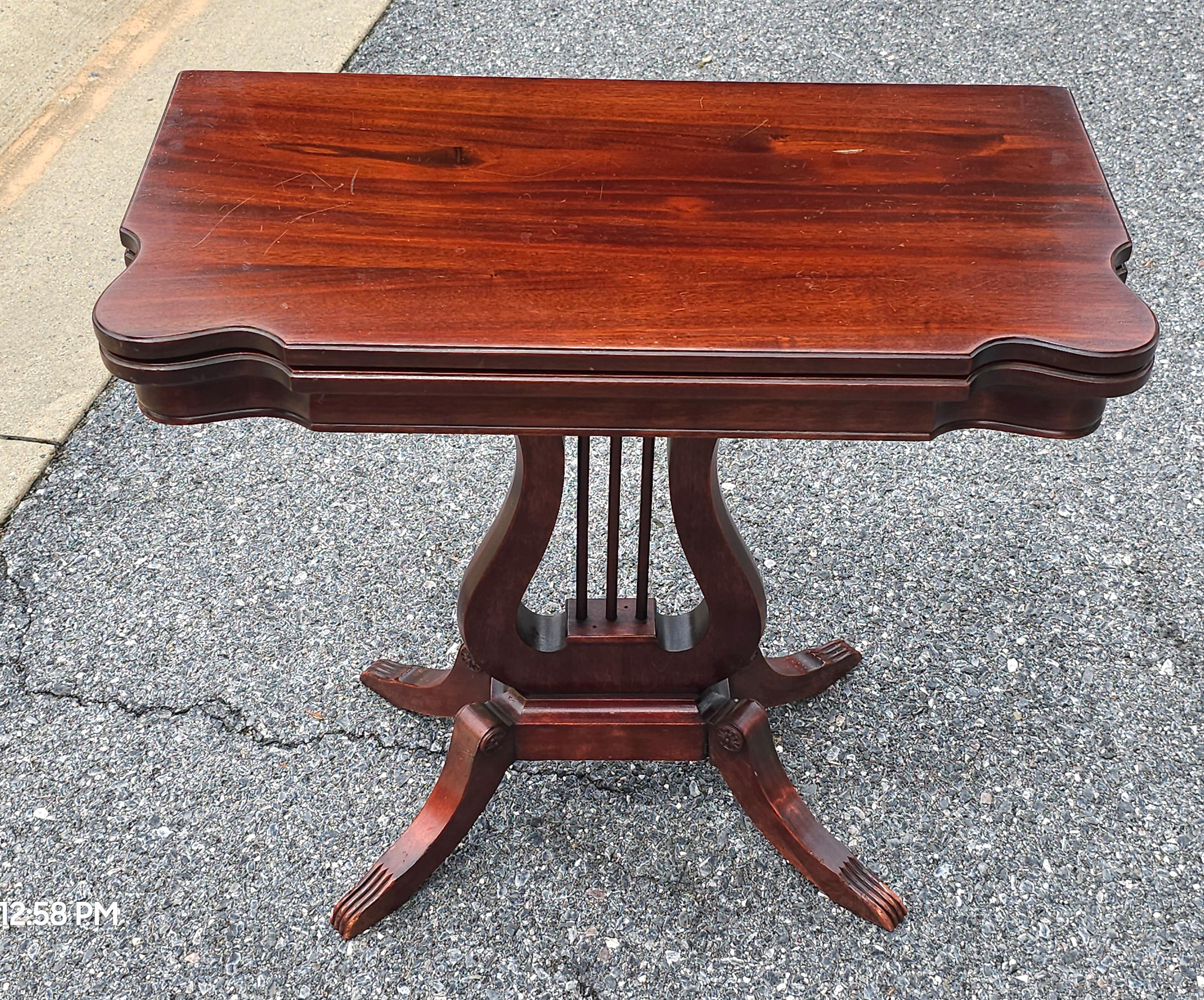 Early 19th Century Lyre Base Mahogany Fold Top Table. Measures 26