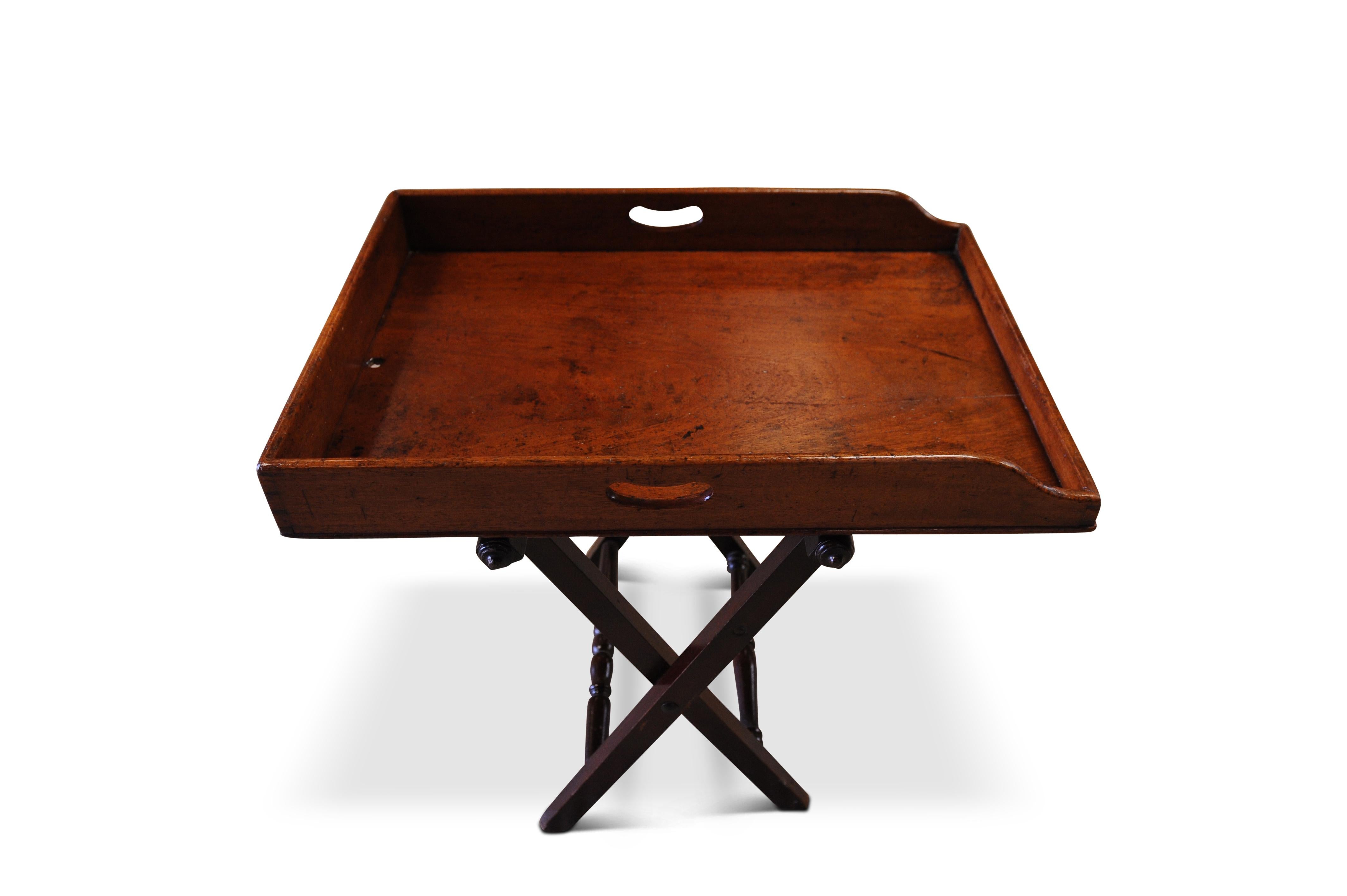 Late 19th century mahogany butlers tray with folding stand and removable tray

- Tray lifts off - ideal for carrying drinks
- Wonderful tray for drinks or collectables in any modern or travel inspired setting
- Beautiful handmade dovetails (as