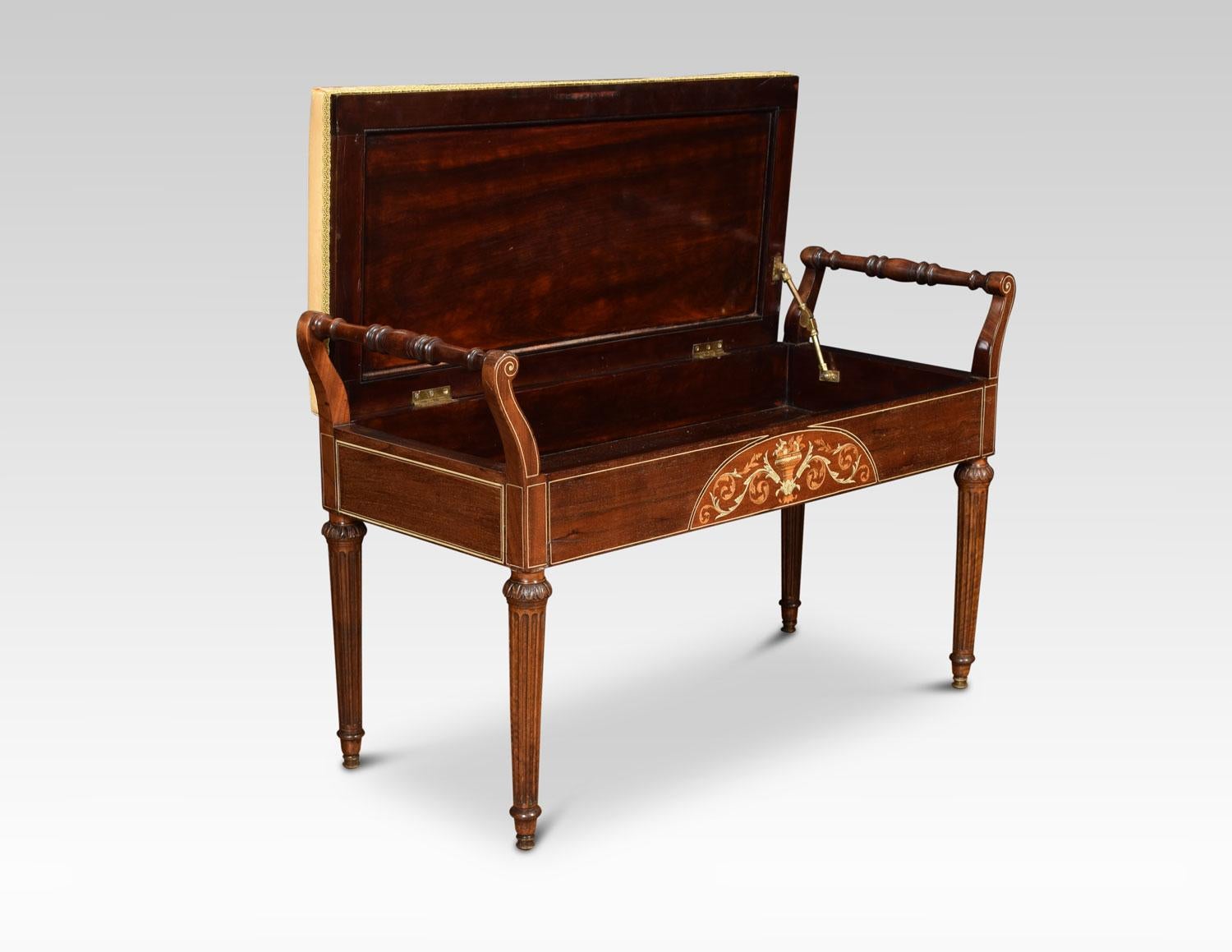 Mahogany inlaid duet stool, the rectangular damask upholstered seat opening to reveal large storage area, flanked by turned scrolling handles. To the freeze finely decorated in inlay, all raised up on four turned tapering legs.
Dimensions:
Height