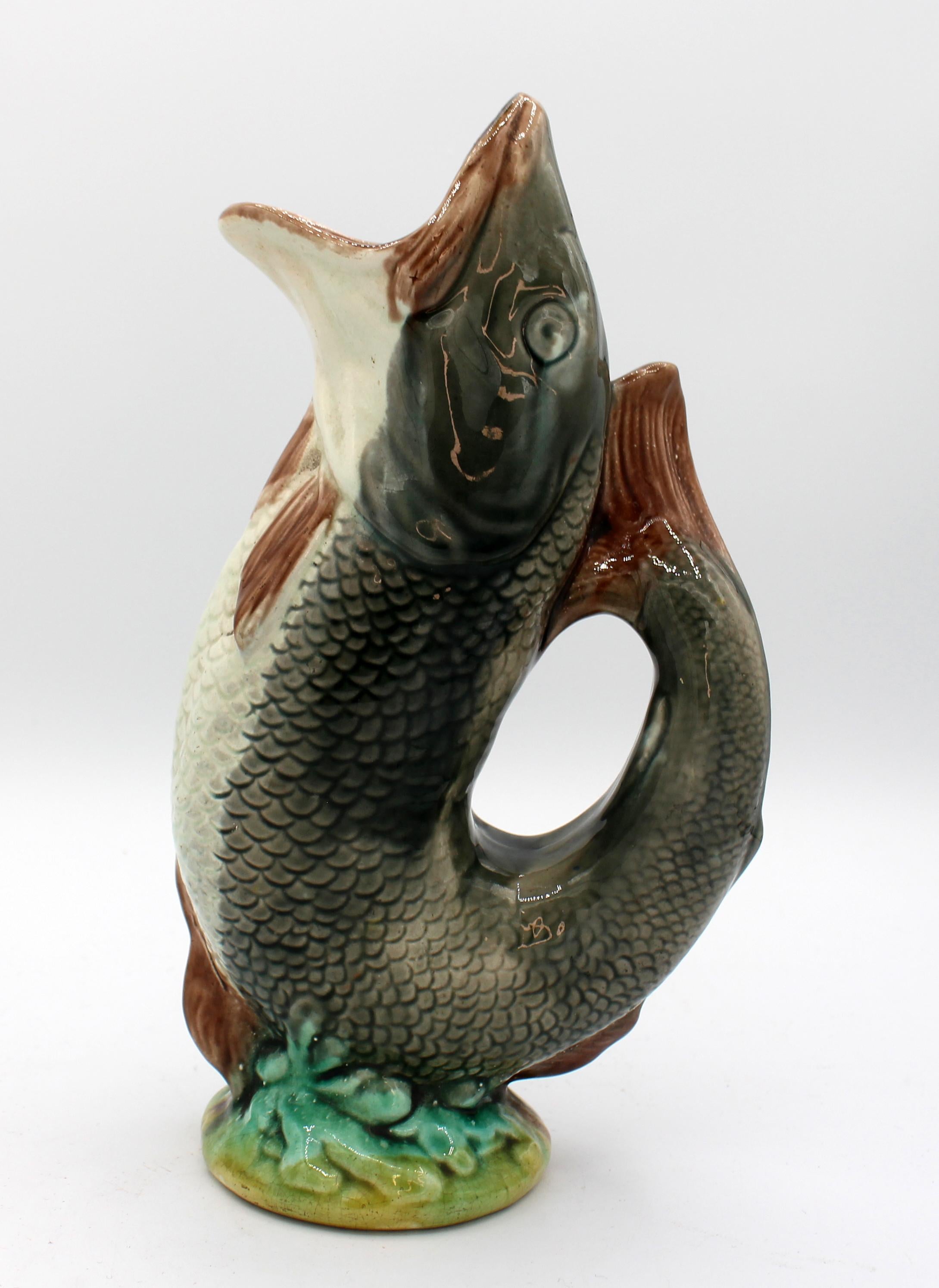 English majolica gurgling trout jug, late 19th century. Particularly well modelled & with good color. Unmarked.
Measures: 10 7/8