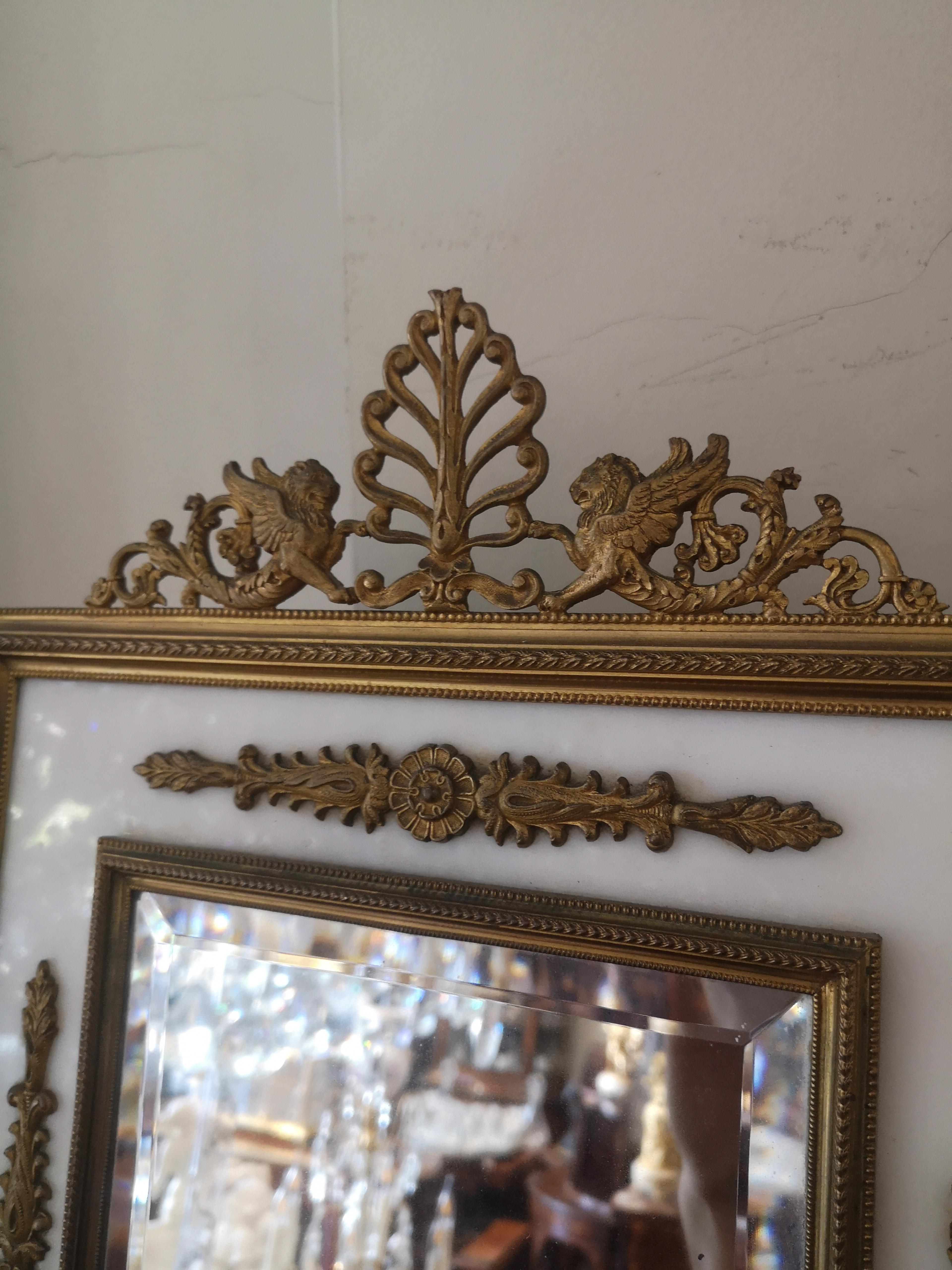 A good quality late 19th century French marble and gilded bronze table mirror. The marble panels with bronze mounts and surmounted with a pair of winged lions. Original bevelled mirror plate and quality bronze easel type back.
French, circa 1880.