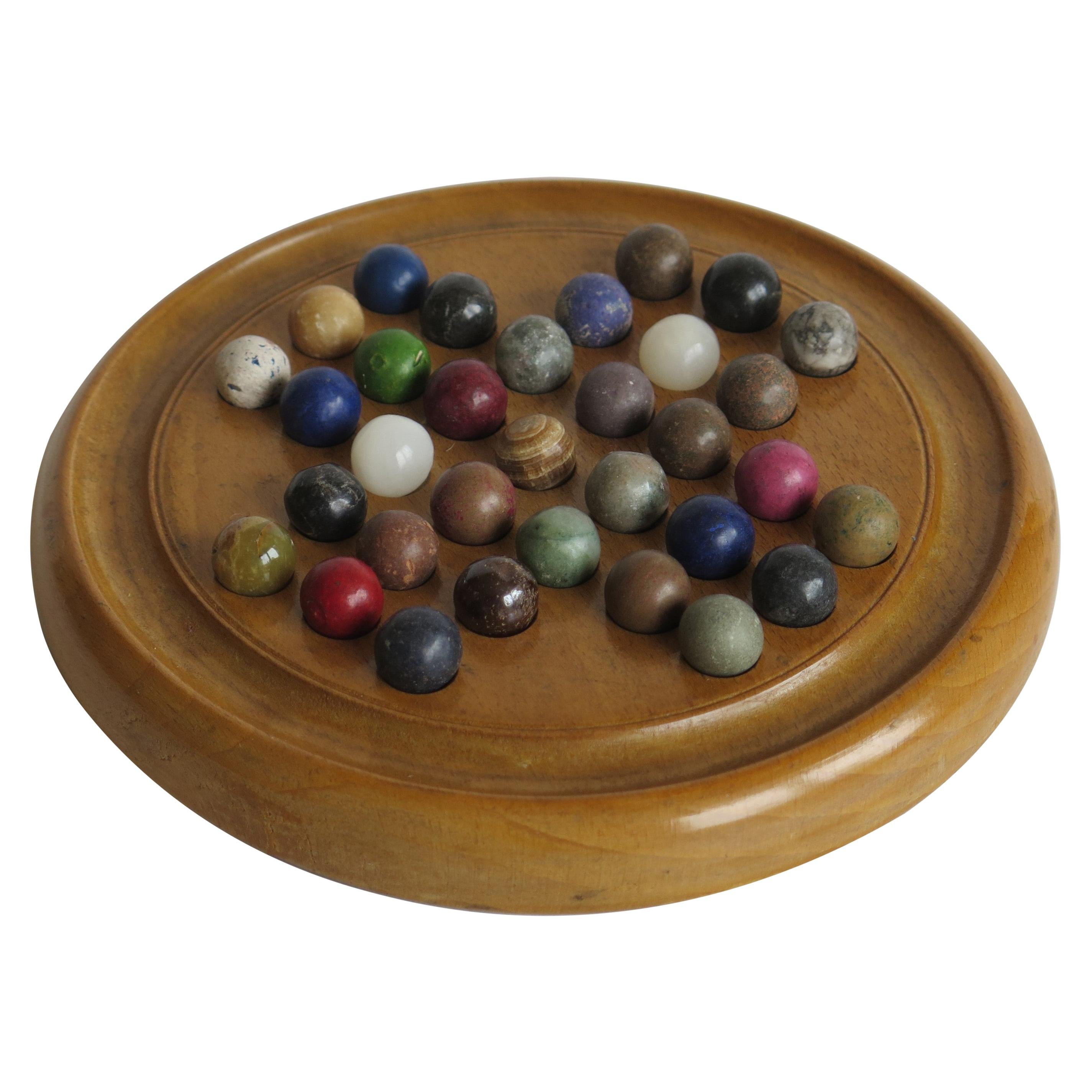 Late 19th Century Marble Solitaire Board Game with 33 Handmade Marbles, Ca 1900