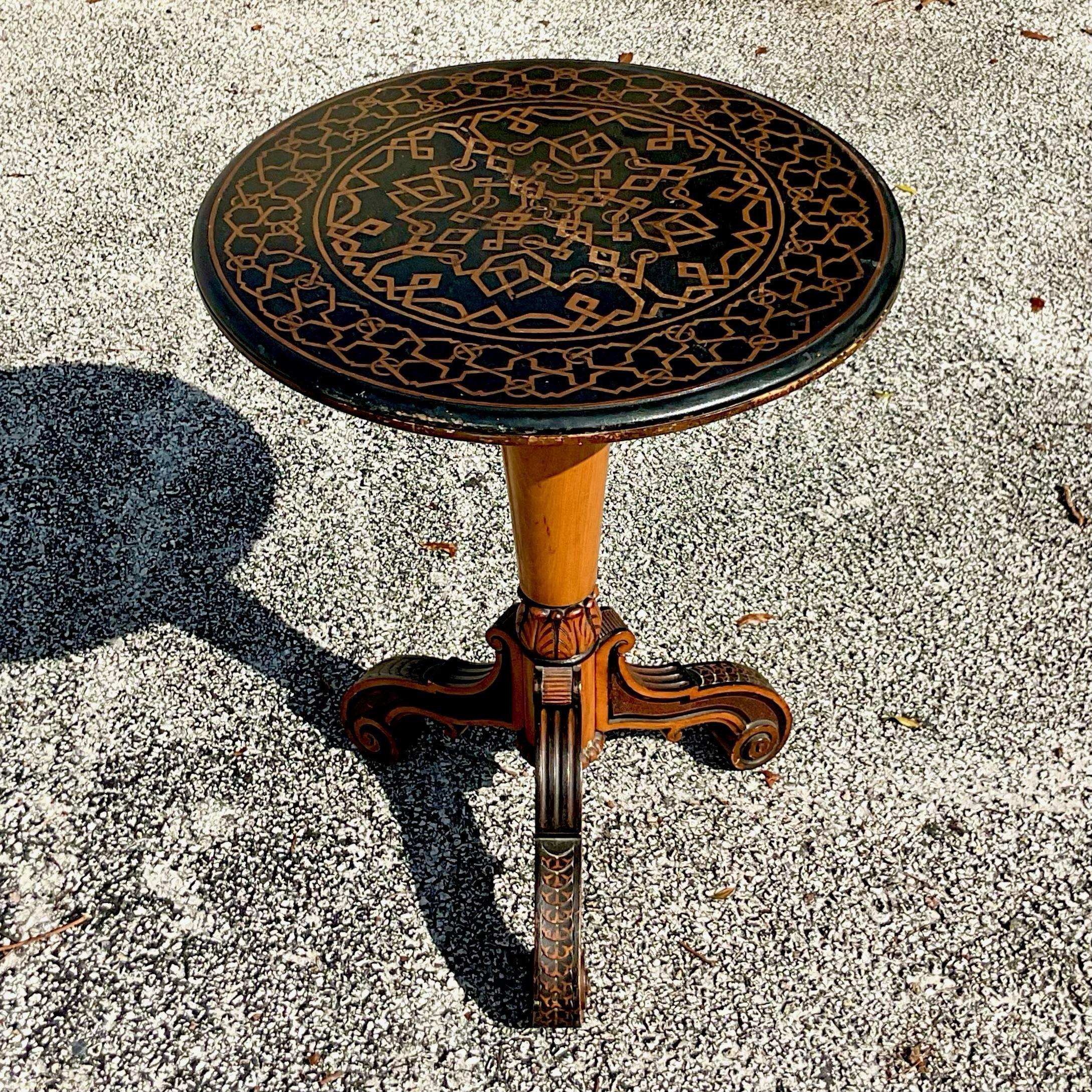 Exquisite antique drop top side table with intricate inlay work on the table top and detailed carvings on the pedestal. The side table is a statement piece for any room adding an element of old world craftsmanship with modern day beauty. The piece