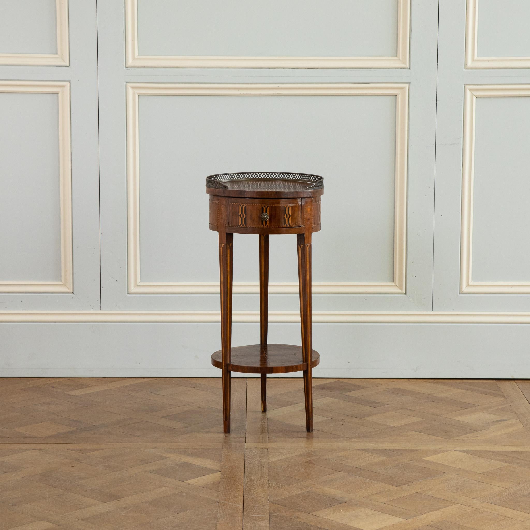 Late 19th Century Marquetry side table 
sitting on 3 tapered legs
Marquetry's work depicts Stars all around
bottom shelve with marquetry work also
the top is surrounded by a pierced bronze gallery.