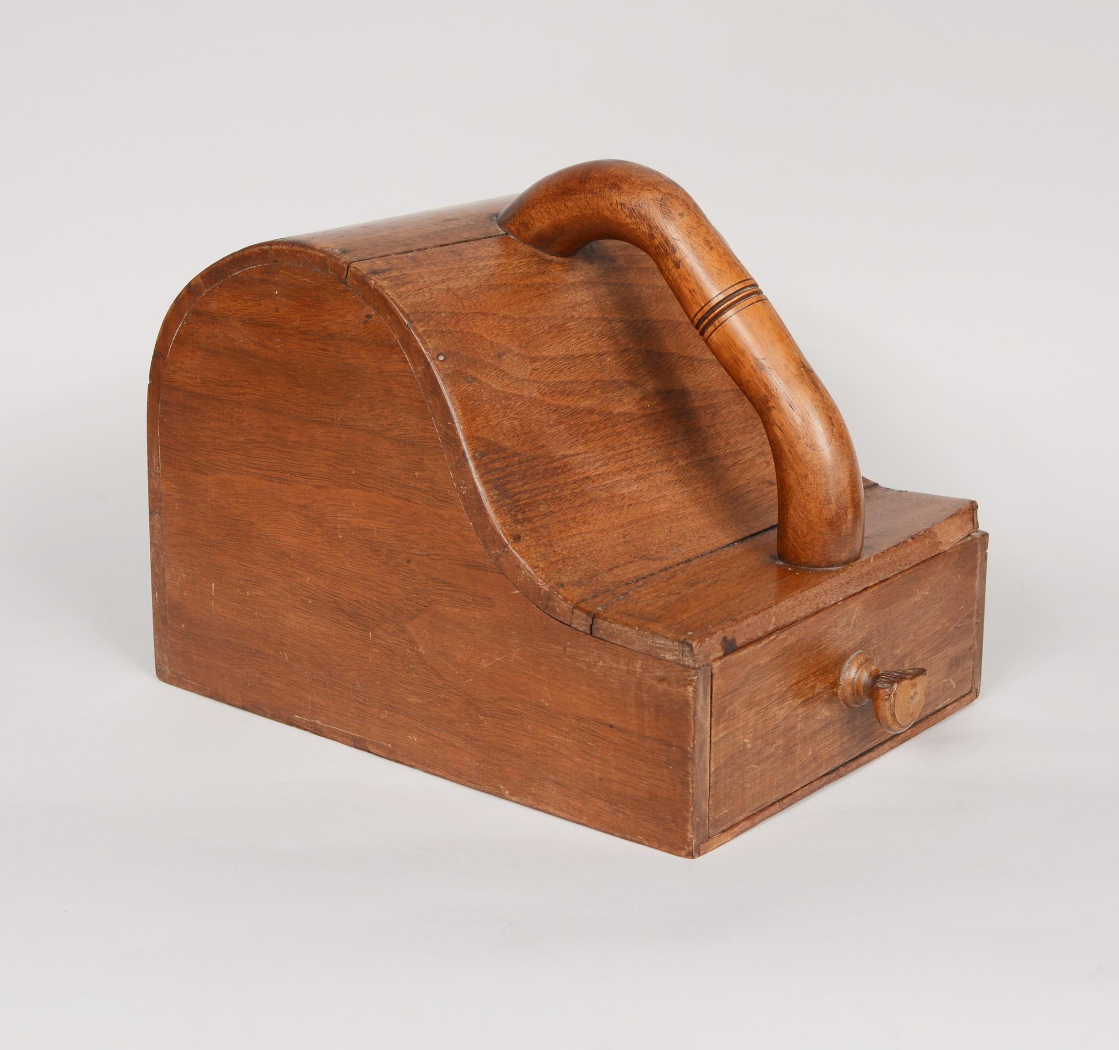 Fraternal organization marble ballot box. The open end on this box would have contained black and white marbles. The members would reach in and cast their vote by depositing the appropriate colored marble through the small hole. The knob on the