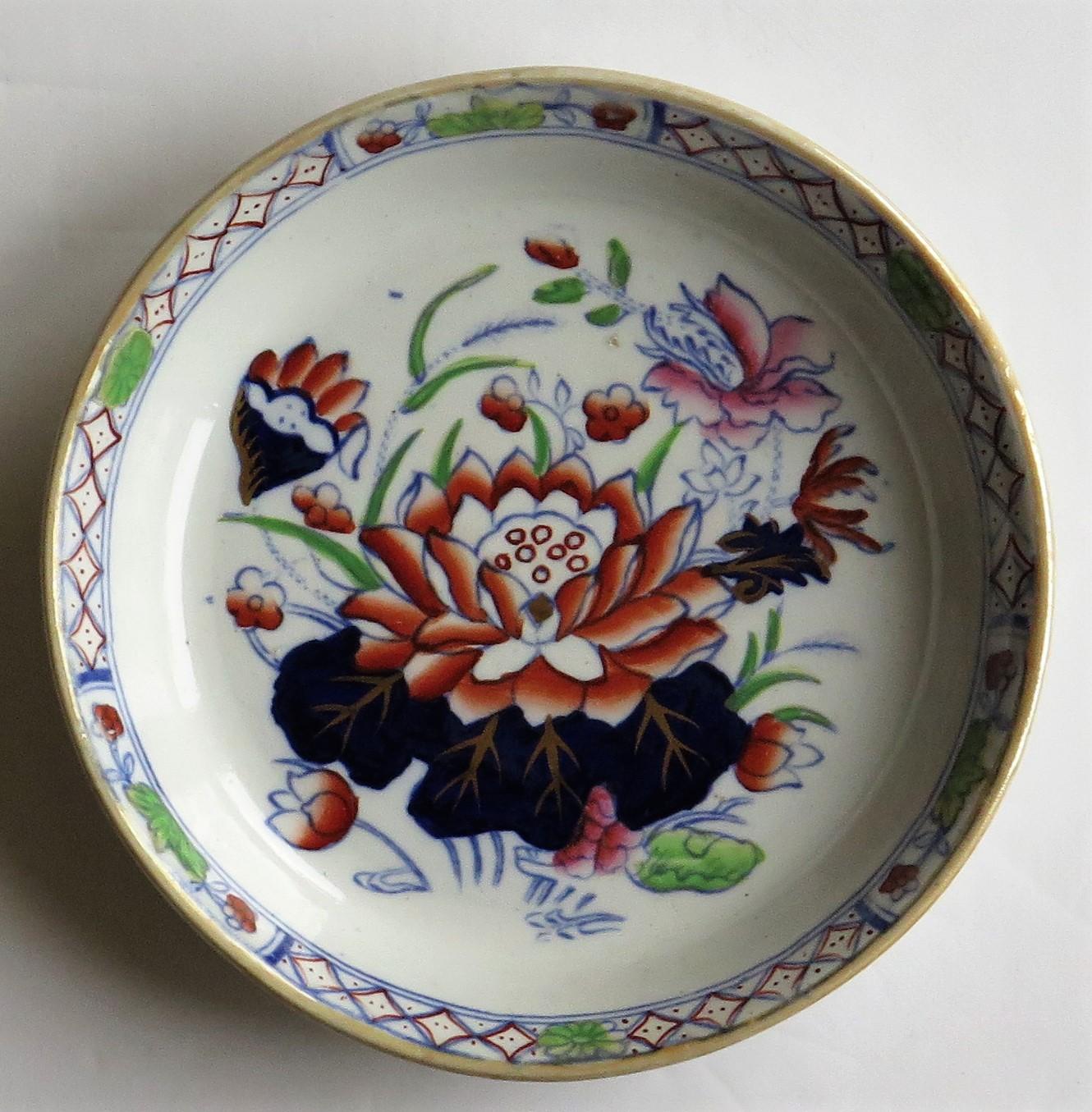 This is a small dish or pin tray in the very decorative water lily pattern, produced by the Mason's factory at Lane Delph, Staffordshire, England, circa 1897.

The dish is well decorated in one of Mason's most beautiful chinoiserie patterns,