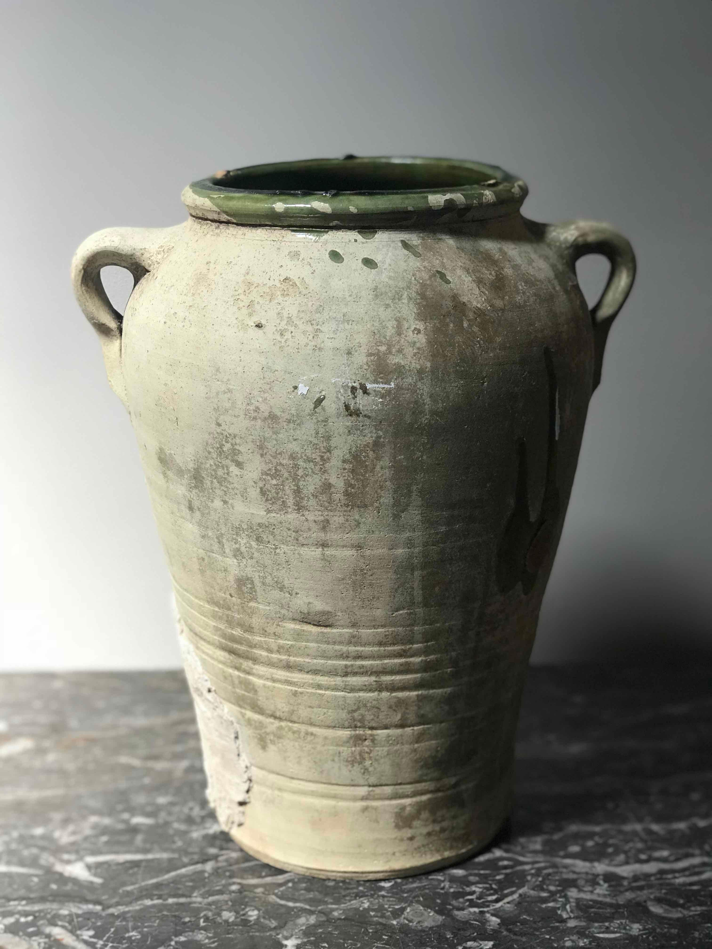 Late 19th century matte textured green olive oil jar from France. 