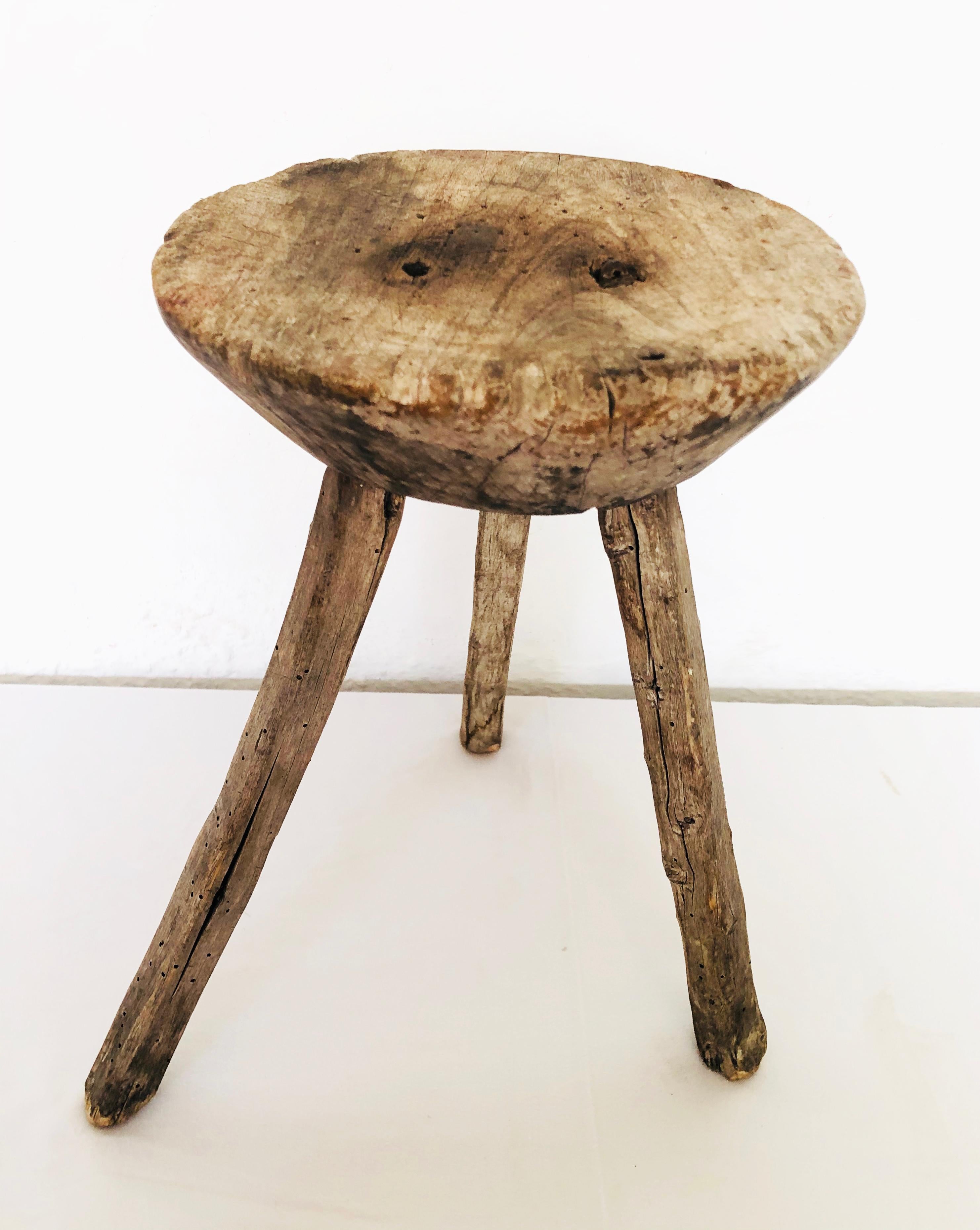 Antique natural Mezquite milking stool wood stool with thick round top found in Western Mexico.
Great for side table or next to a tub.
 