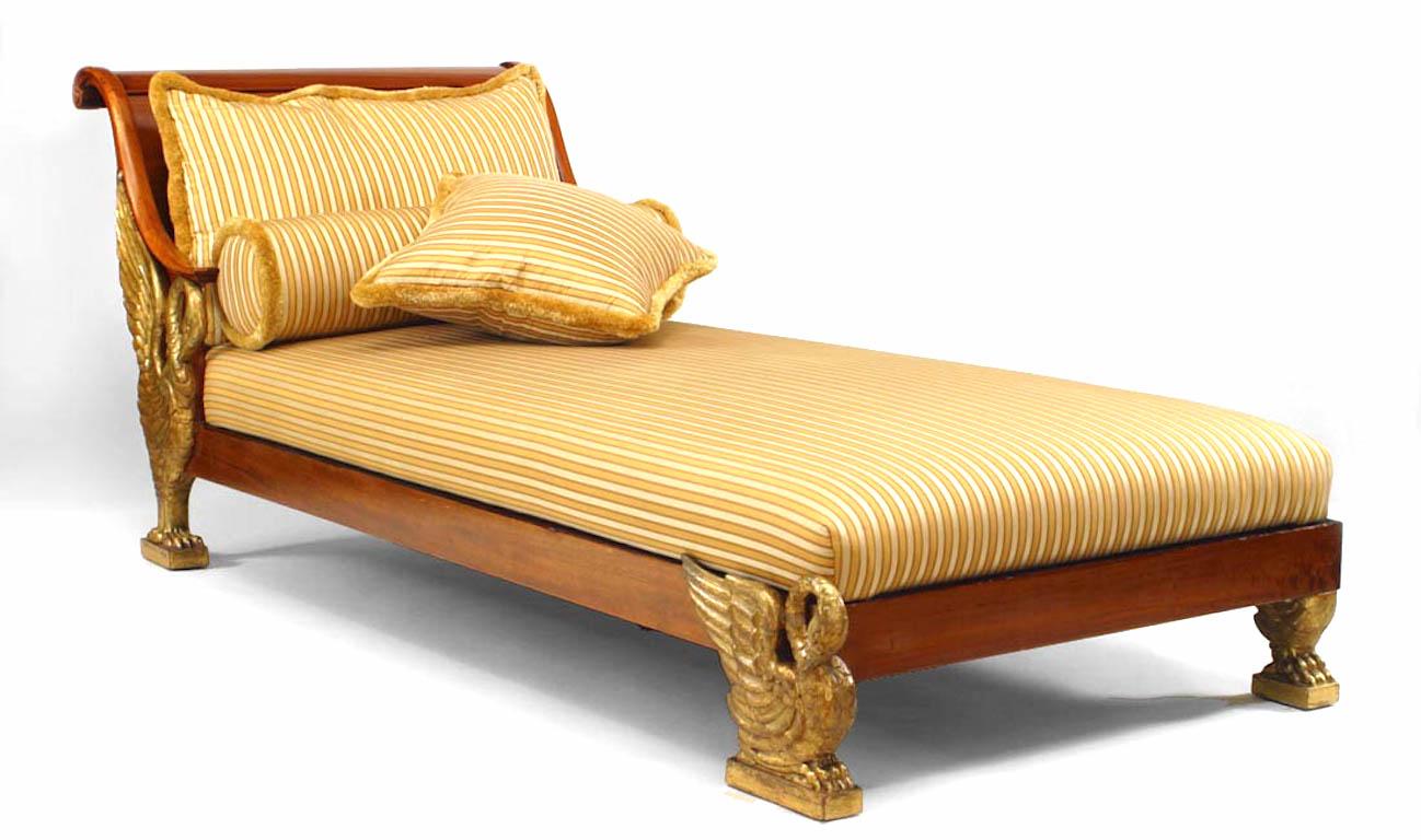 Continental Neoclassic-style (Possibly Austrian, late 19th Century) parcel gilt mahogany daybed/chaise lounge with scrolled back above a stripped yellow silk seat on swan legs.
