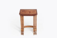 Late 19th Century nest of tables consisting of four satinwood tables