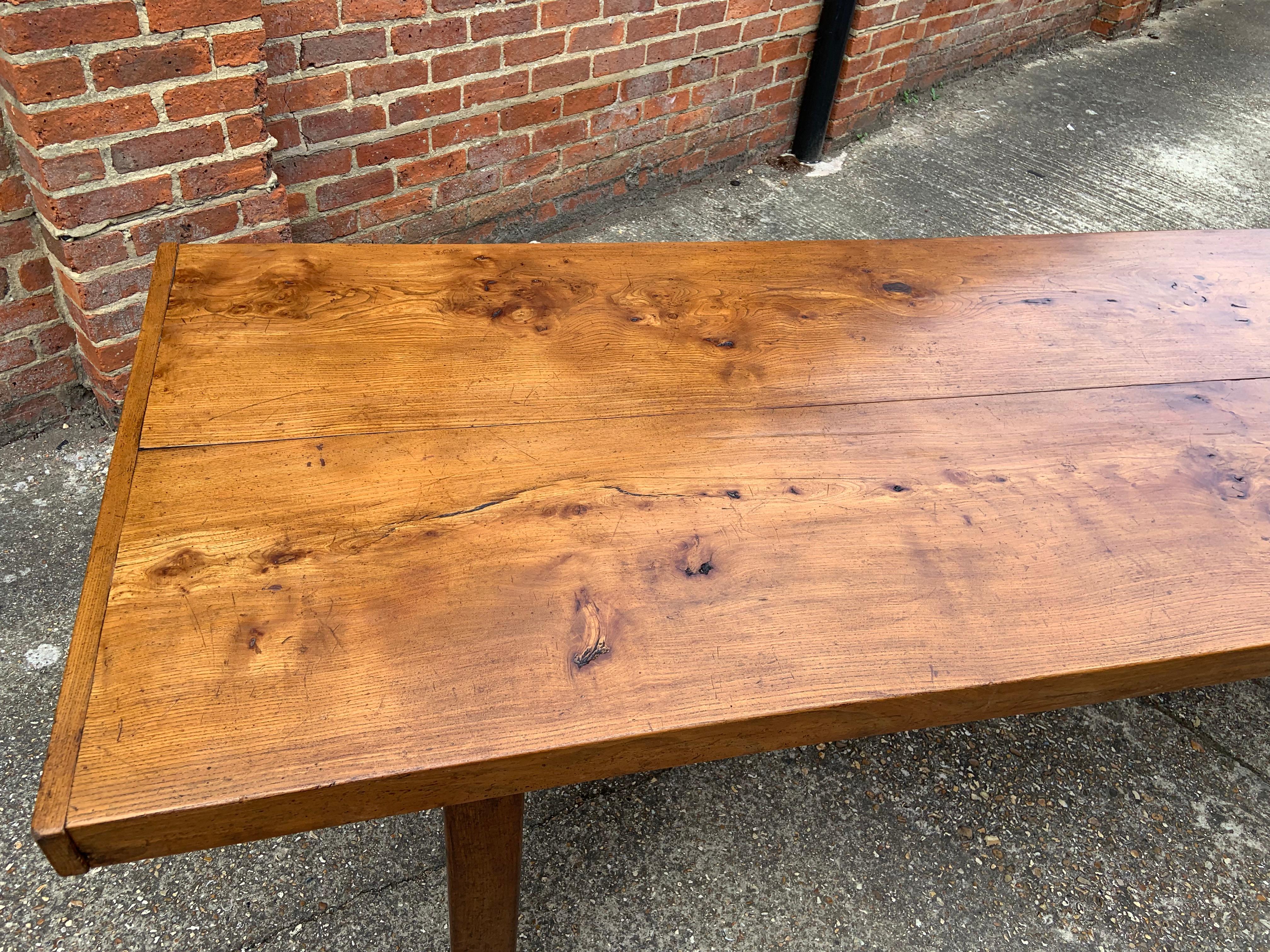 Late 19th century Normandy Elm farmhouse table with H stretcher. Beautiful thick elm top. 


