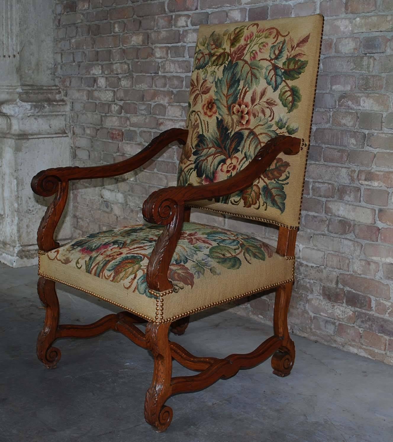 A beautiful antique chair with a solid oak handcarved frame and needlepoint upholstery.
The oak frame has the classical accanthus leaf motifs on both the armrests as well as its legs.
The upholstery is in good condition.
