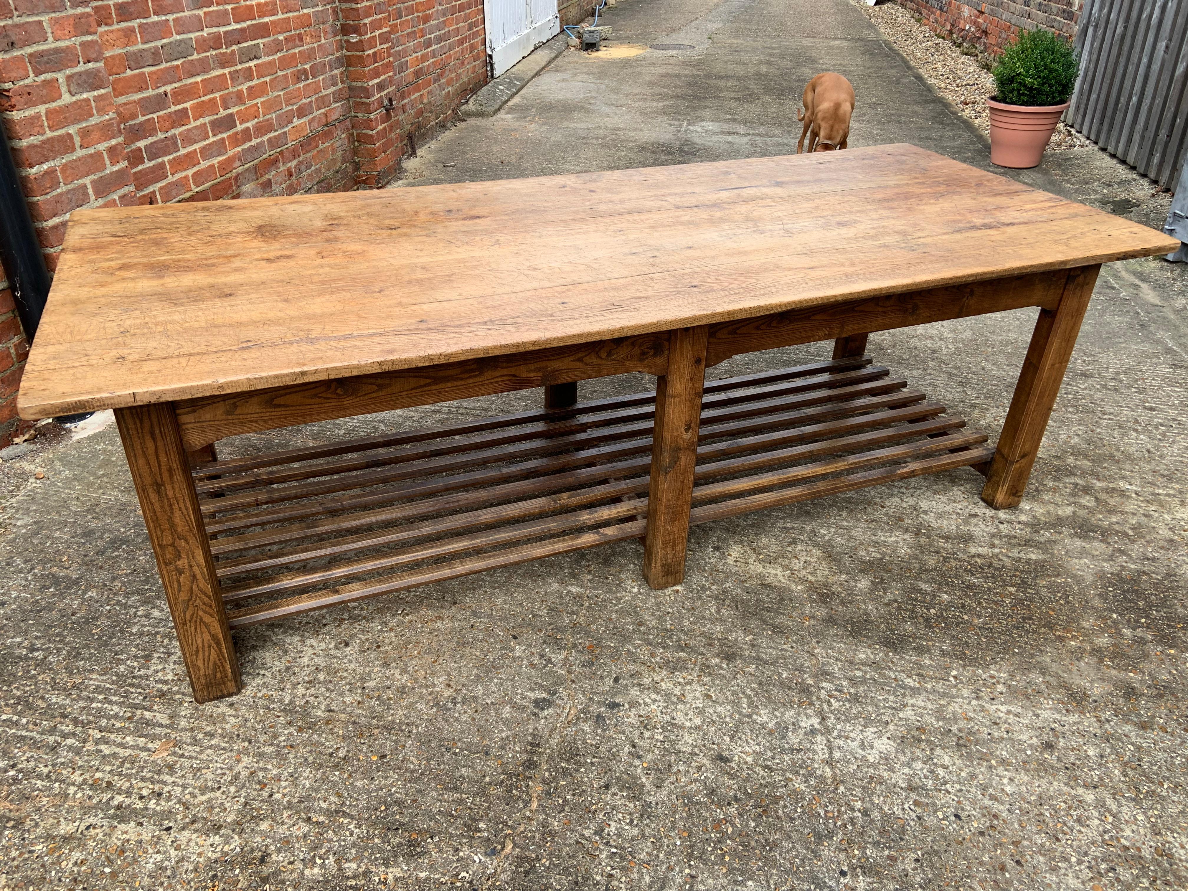 ate 19th century oak farmhouse table with apple shelf. The has six legs and ample leg room. The has one end drawer and one side drawer. Gorgeous honey brown colour. 
  