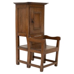 Late 19th Century Oak Porters Chair with attached Cupboard and Shelf behind