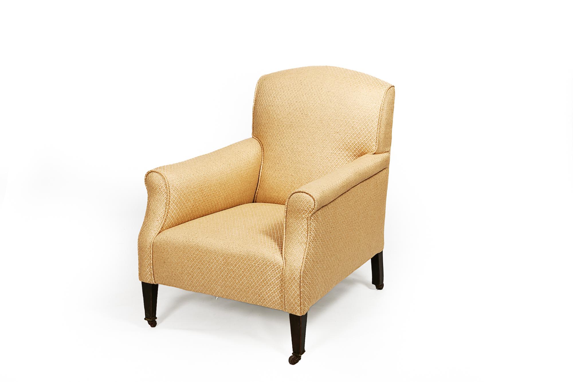 Late 19th century occasional club armchair, fully upholstered on tapered legs.