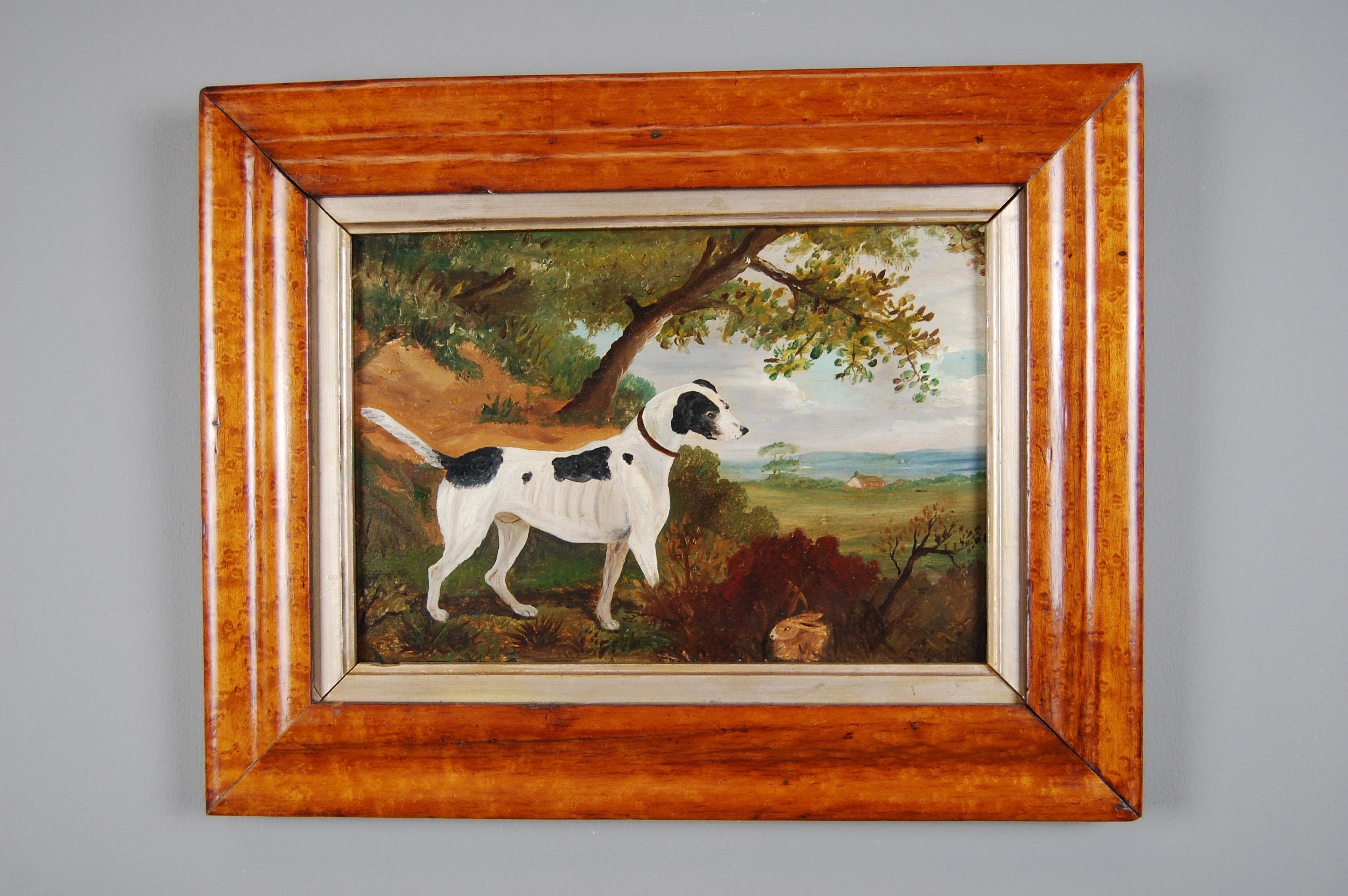 English Naive school oil on panel. Terrier on scent in a countryside scene, with a smart, small rabbit evading attention in the foreground and the farmstead in the distance.