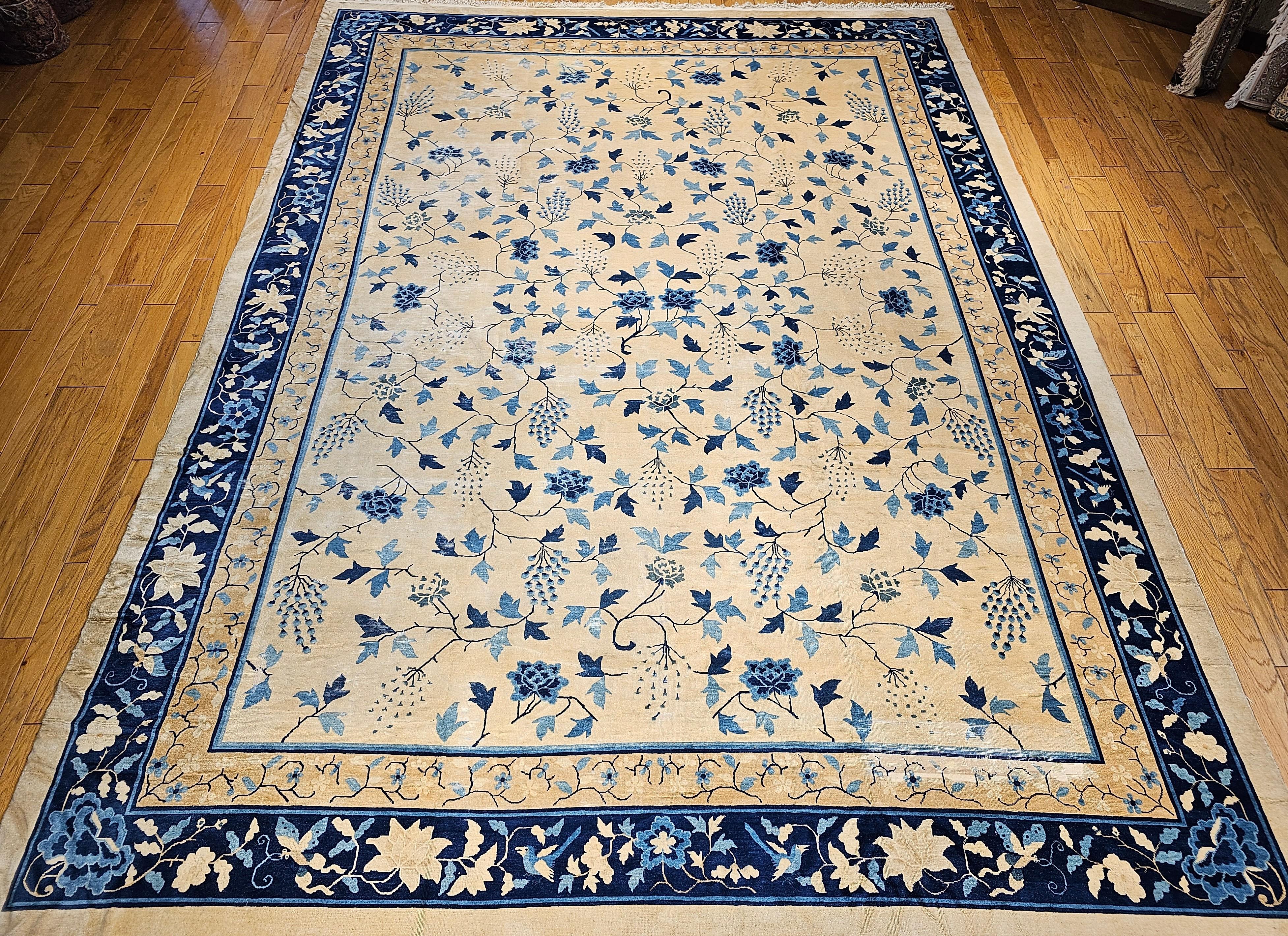 Late 19th Century Chinese Peking oversize rug in an all-over leaf pattern in ivory, and blue colors.  The weave in this beautiful rare rug is very fine and the rug has a wonderful color palette with a cream/antique white color field and a blue color