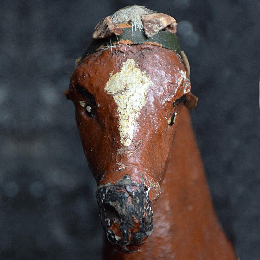 Late 19th century oversized papier maché pull along horse toy
We are proud to offer an oversized 19th century Folk Art papier maché pull along horse toy. A handmade example with unusually large propositions, with textured layered paint, real