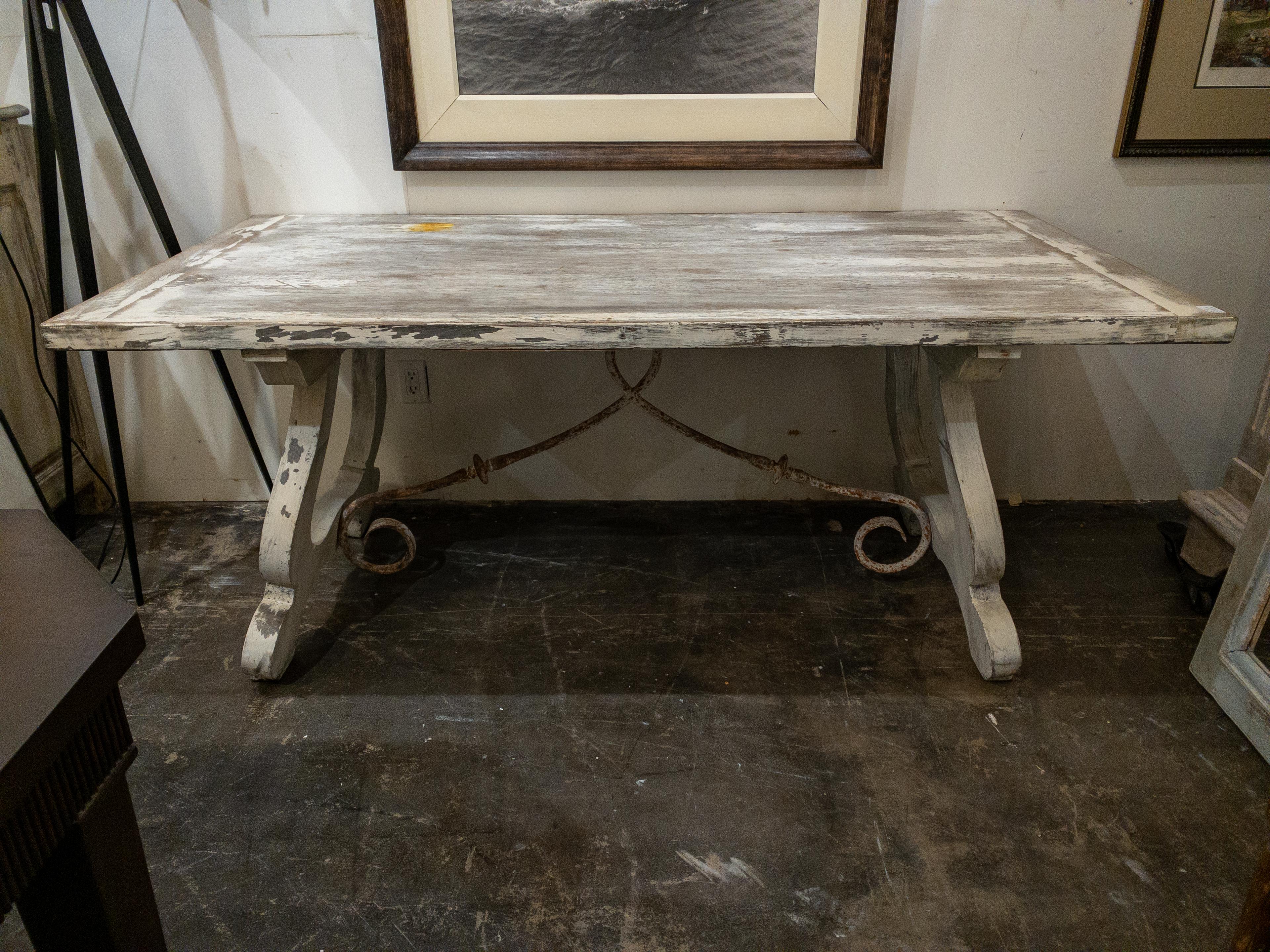 The Late 19th Century white painted dining table is a charming embodiment of rustic elegance and enduring craftsmanship. Its design harks back to a bygone era, where simplicity and functionality were celebrated.

The plank top, a hallmark of this