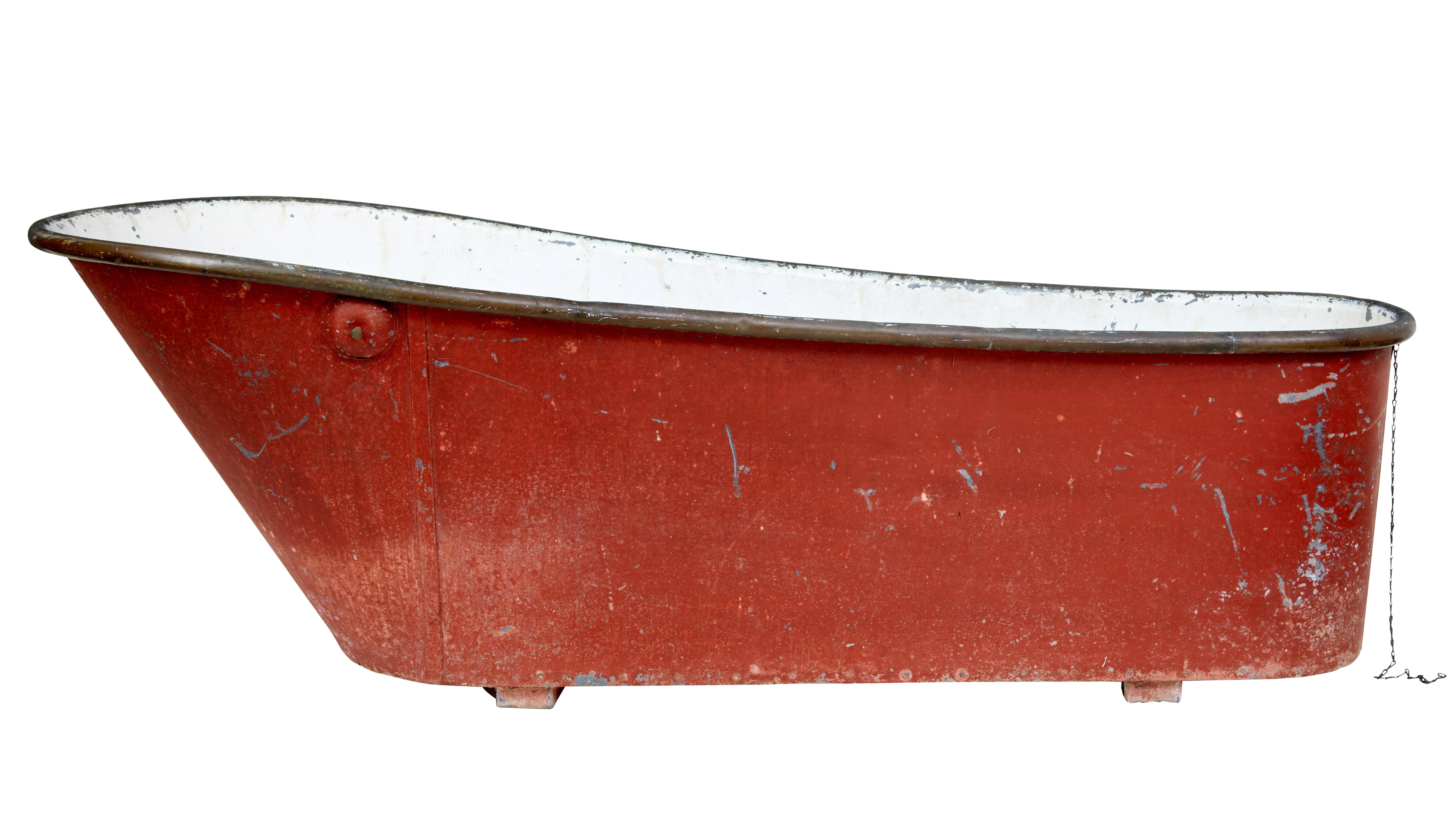 We are pleased to offer this rural Swedish bath tub in its original condition, circa 1890.

Painted a burnt red on the outside and white on the inside. Thick tin bath with copper rolltop edge.

Beautifully shaped back rest for comfort. Plug hole