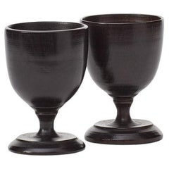 Late 19th century pair of antique ebonised egg cups, UK