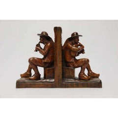Late 19th century pair of Black Forest carved walnut bookends, Circa 1900