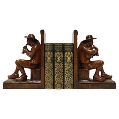Late 19th century pair of Black Forest carved walnut bookends, Circa 1900