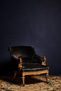 Late 19th century pair of blue velvet armchairs with wooden shell and carved and