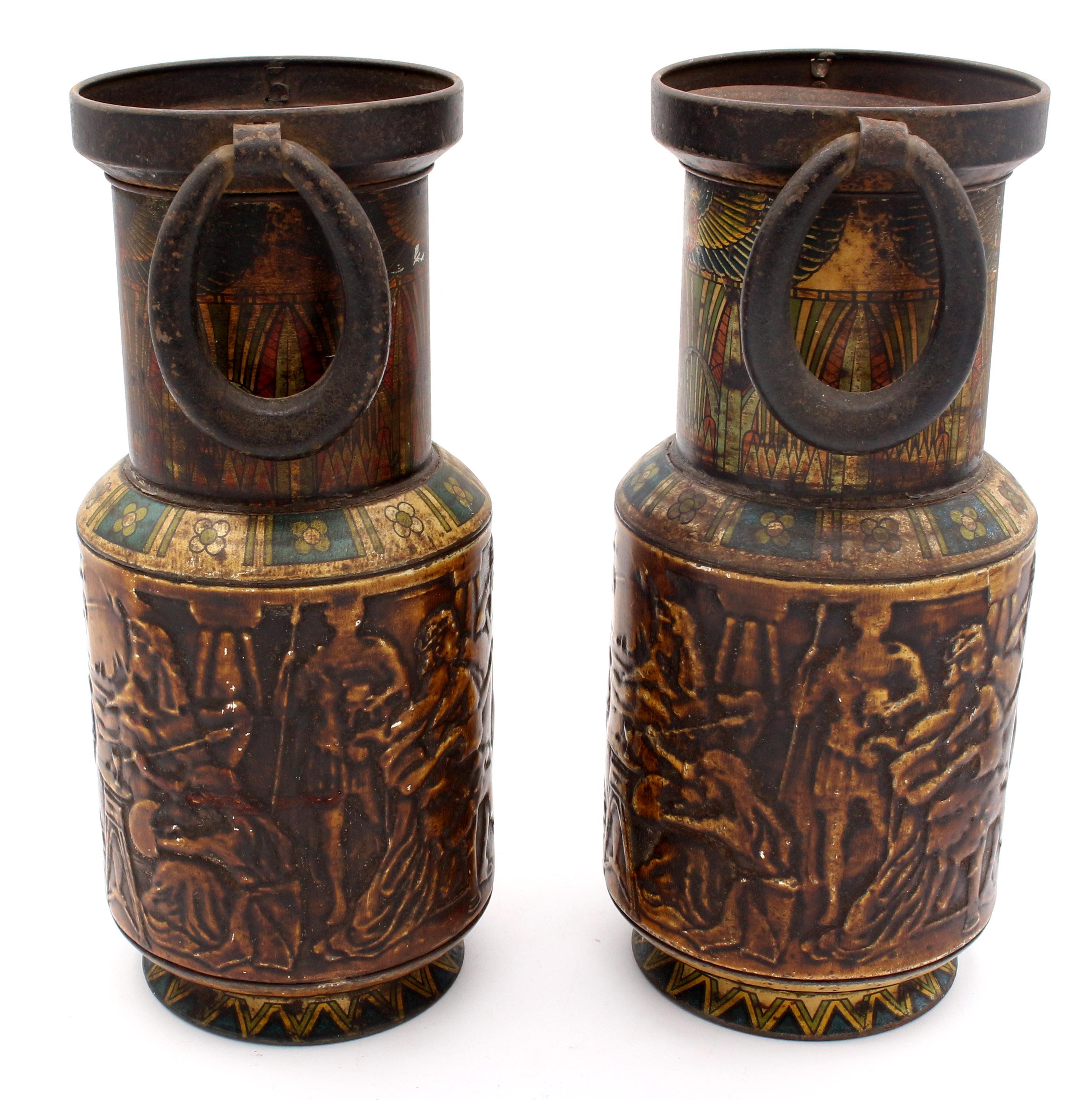 An unusual, exotic pair of Egyptian Revival Canopic Urns with Cleopatra embossed - actually bisquit tins by Huntley & Palmers, late 19th century.