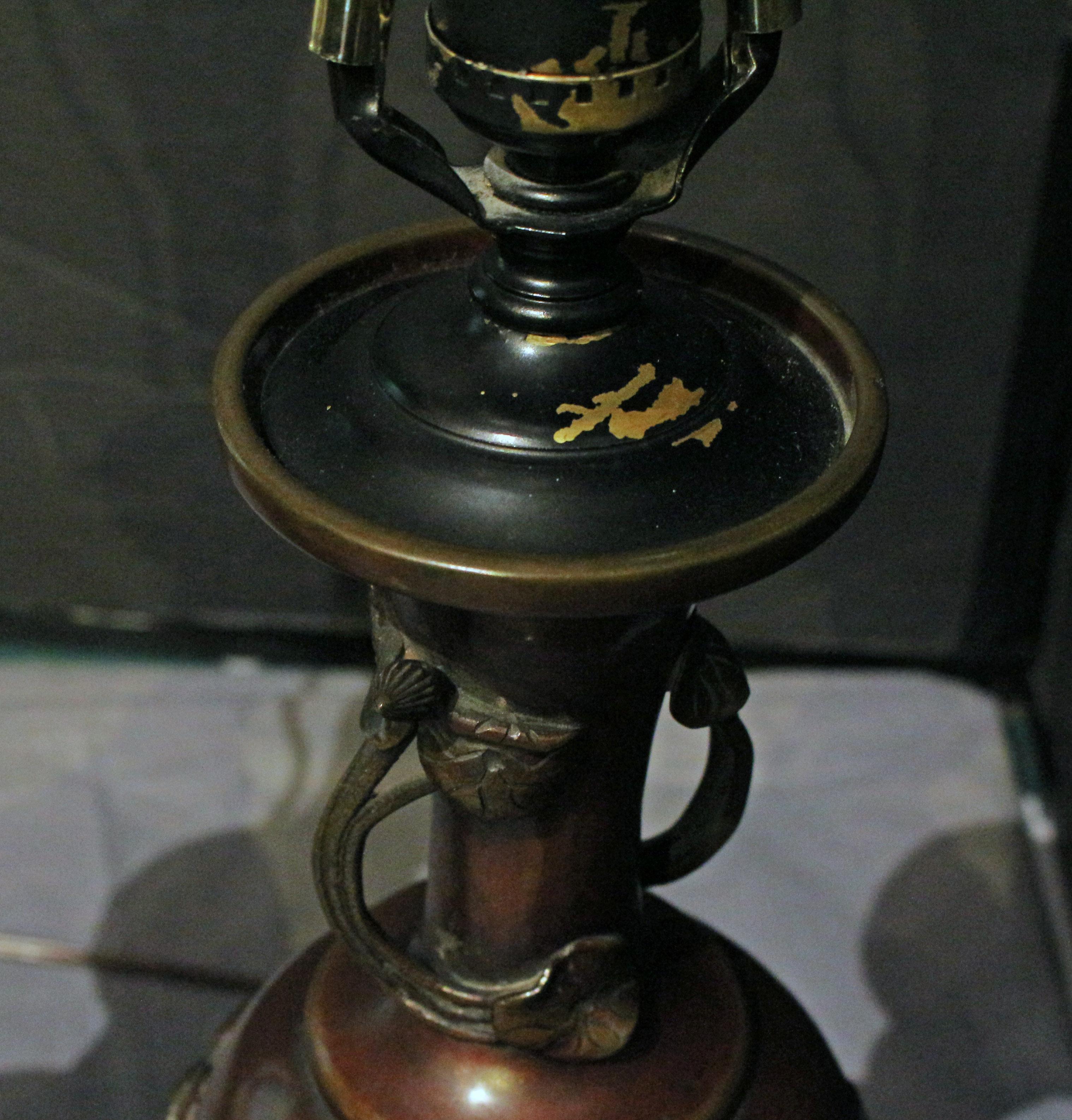 Late 19th century pair of Japanese bronze vases mounted as lamps. Meiji period. Well decorated with prunus & hawks - some on branches & some in flight. Neck of entwined lilly pads & buds. All evocative of Spring. Stands & shades from Batts Lamps,