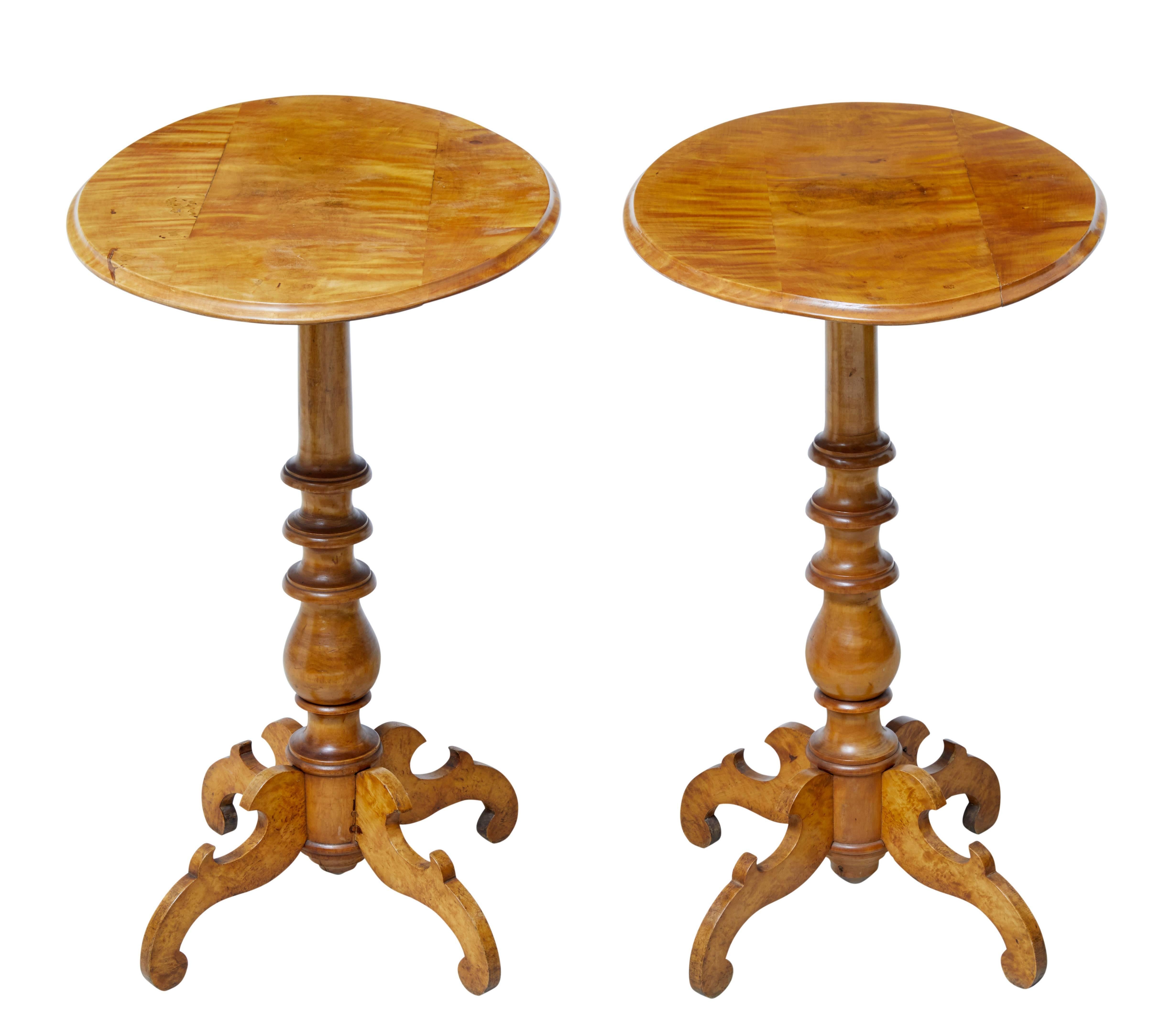 Fine pair of oval top Swedish birch occasional tables, circa 1890.

Elegant pair of occasional tables with multiple uses. Good rich birch color.

Oval tops with turned stem, standing on four scrolled legs.

Small area of fill to one top which