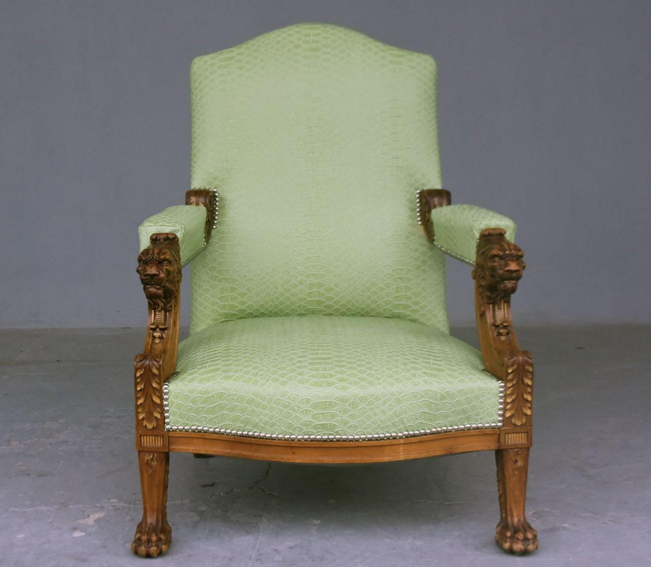 Pair of walnut armchairs with lion claw feet late 19th century. Decoration with golden foliage. Recently covered with imitation leather imitation tortoiseshell lizard color Pistachio tissue.