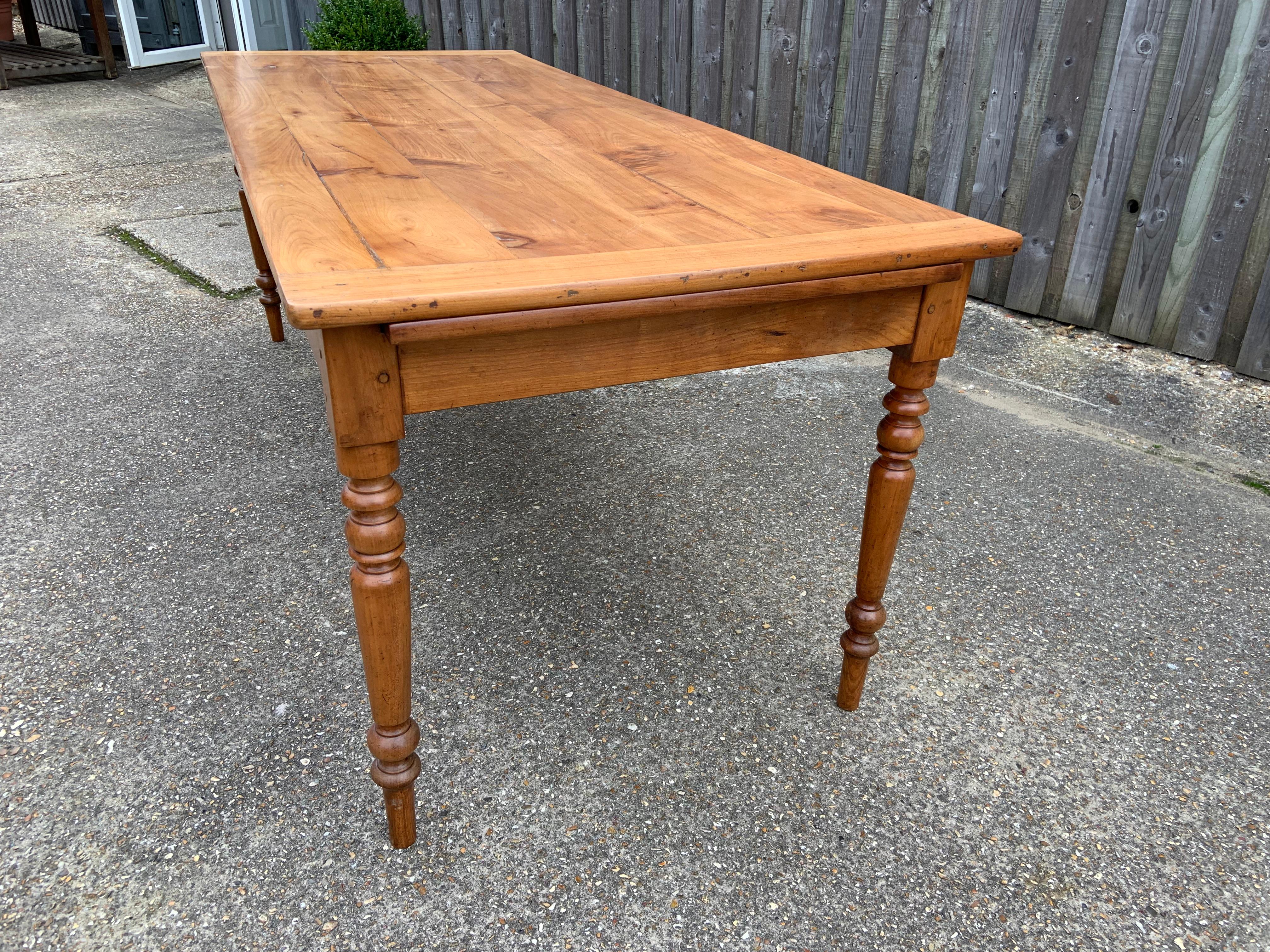 Late 19th Century Cherry Farmhouse Table with good size bread slide. Bread slide measurements 25.5 w x 17.5 l. Pale cherry top with gorgeous turned legs.
