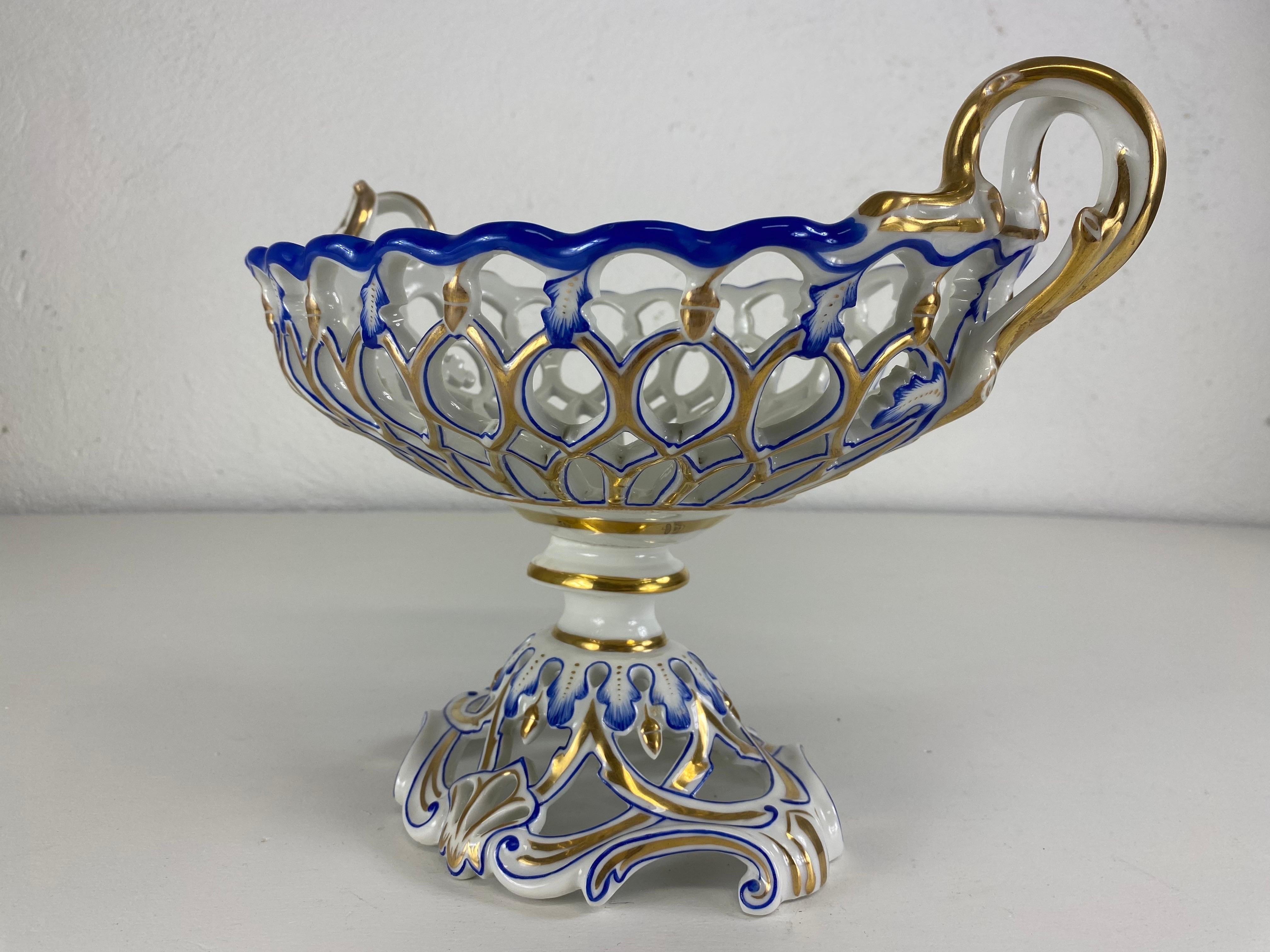 This is an exceptional late 19th century Paris porcelain decorative bowl. This bowl has been handpainted in cobalt blue and 22 karat gold with an elaborate fretwork design. This elegant bowl was handcrafted in France circa 1880.
