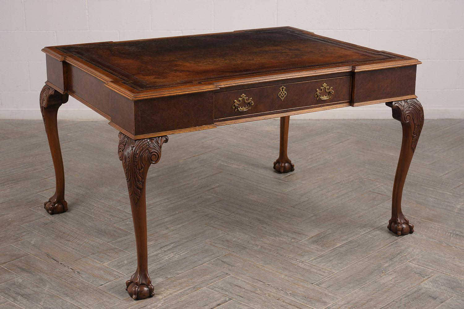 This is a 1880s partners desk. Made from mahogany wood, with its original finish. Has original embossed leather top, that has been re-dyed in a dark brown color. Both sides have a single center drawer with Dual brass handles and a center design