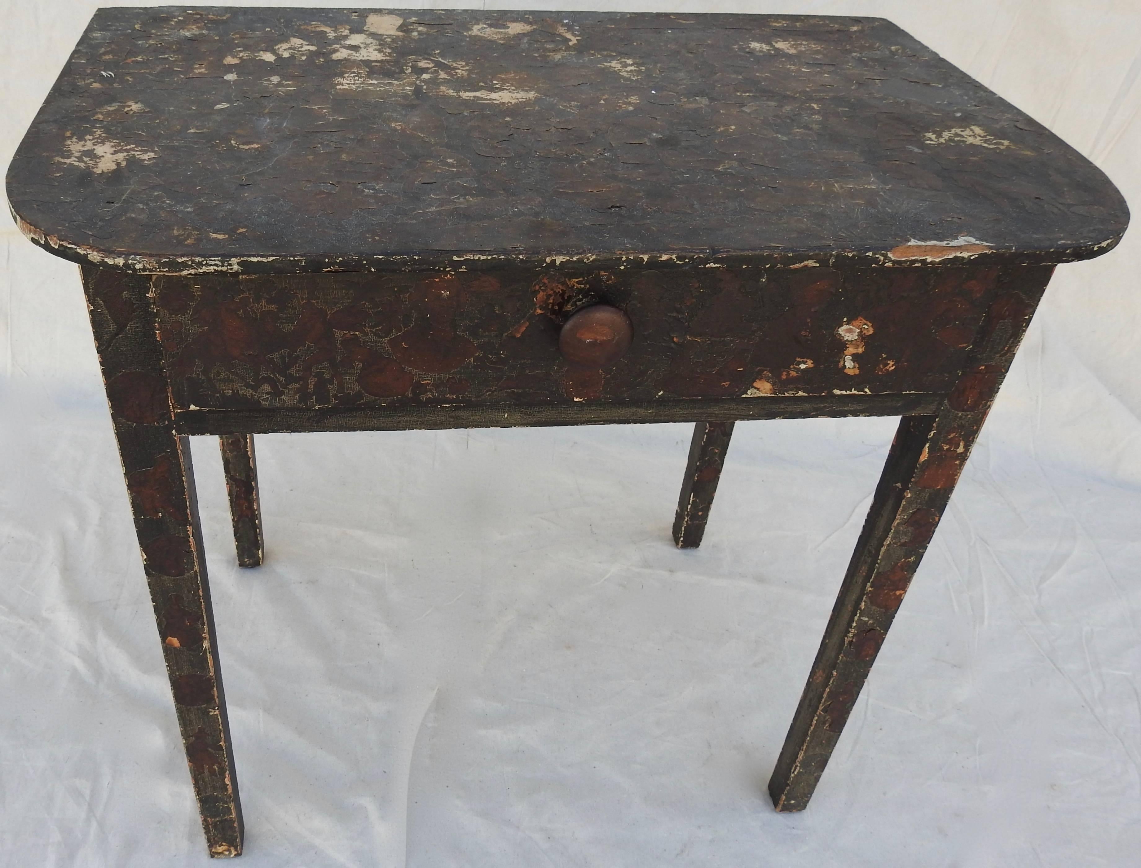 Every time you look at the variety of the decoupage figures on this table, you will see something new! The simple lines of the table are finished in black. The decoupage has a dark finish also. The single drawer is dovetailed with a simple knob.