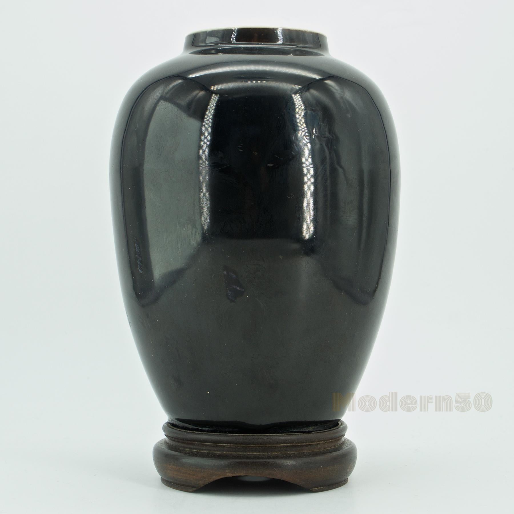 Late 19th century Chinese ‘black mirror' porcelain vase, Kangxi marks to the underside of the base, Late Qing dynasty. Puncture to bottom, was found as a lamp. Height without stand is 7 inches.