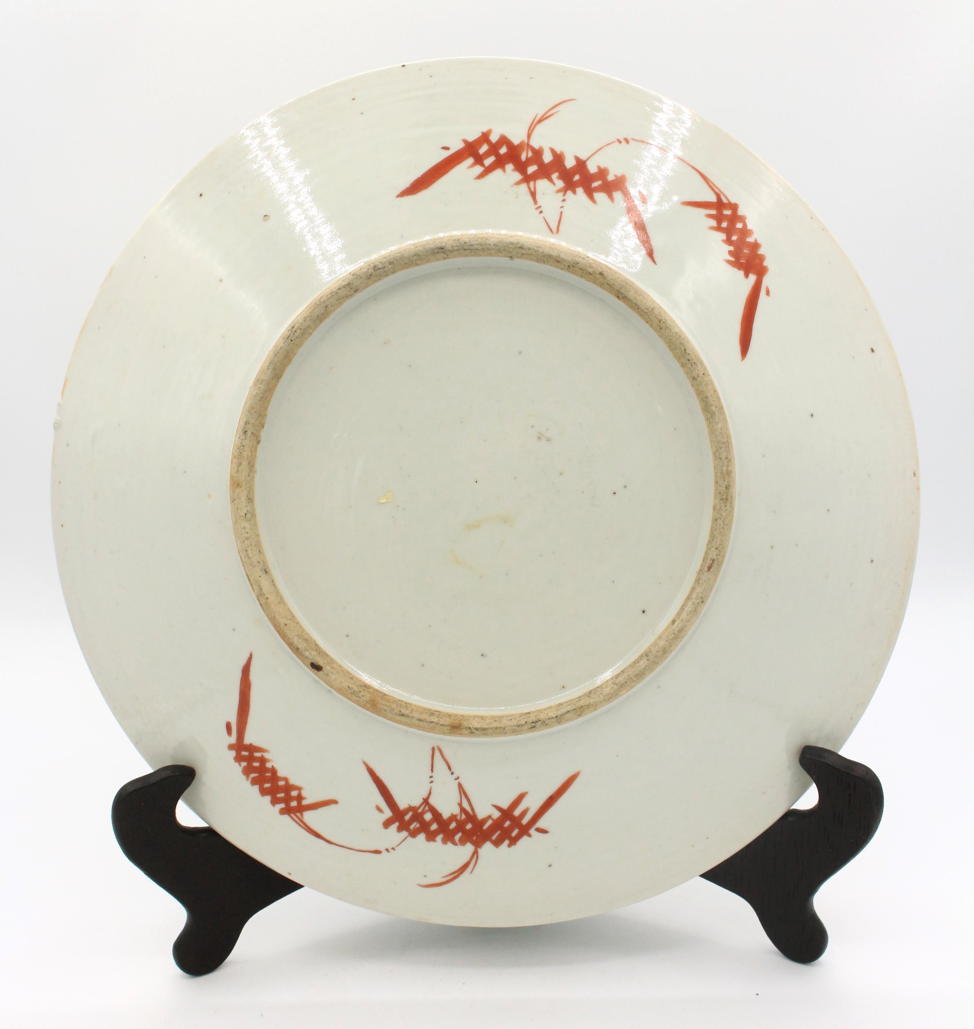 Late 19th century Qing dynasty chop plate, Chinese export. Famille rose palette, turquoise border. Central medallion with crane perched amid waves surrounded by vase of flowers and other floral decoration. One small rim chip. 11 9/16