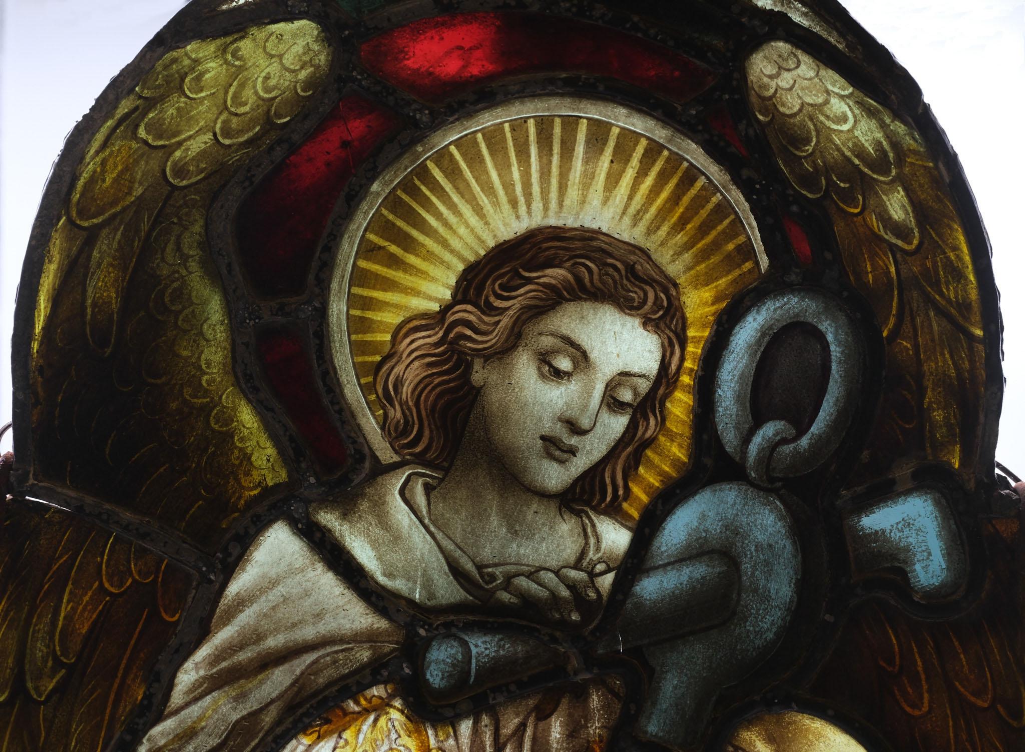 Late 19th Century quatrefoil stained glass angel with anchor. Circa 1880.

Excellent composition, in original unrestored condition. The glass will need a thorough clean. A metal fitting with chain has been made at some point to hang it on the wall.
