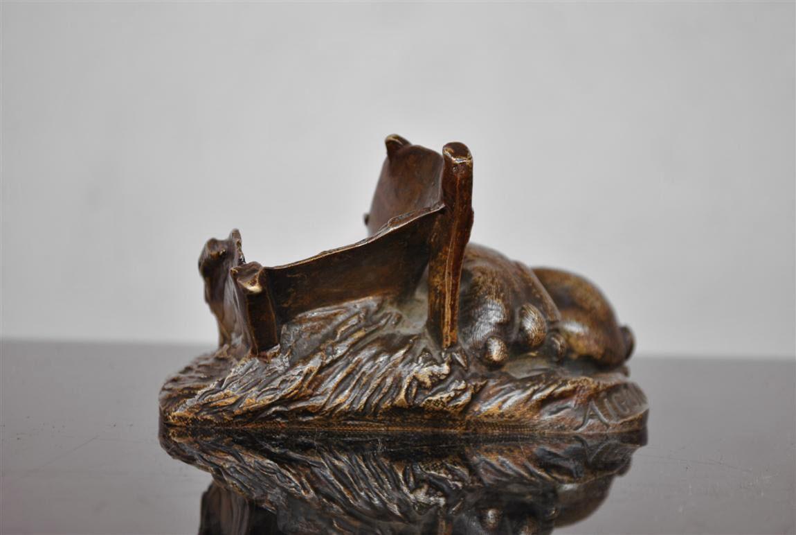 Animal bronze by Antonin Aigon (1837-1885) representing rabbits near wheelbarrow, circa 1880. Brown patina.