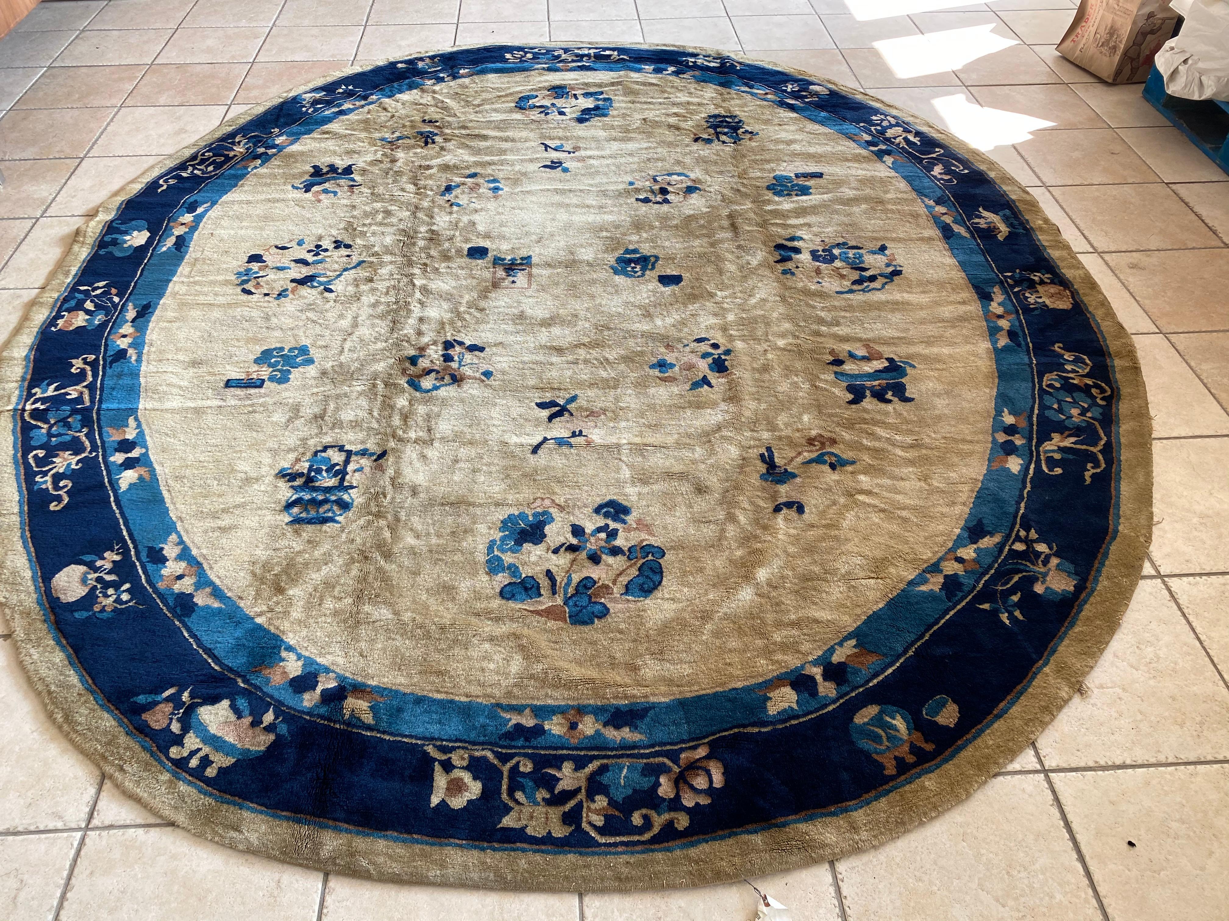 This is a lovely Late 19th Century Antique Gold Oval Peking Chinese Area Rug c. 1880-1900 measuring 9.7 x 8.1 ft.