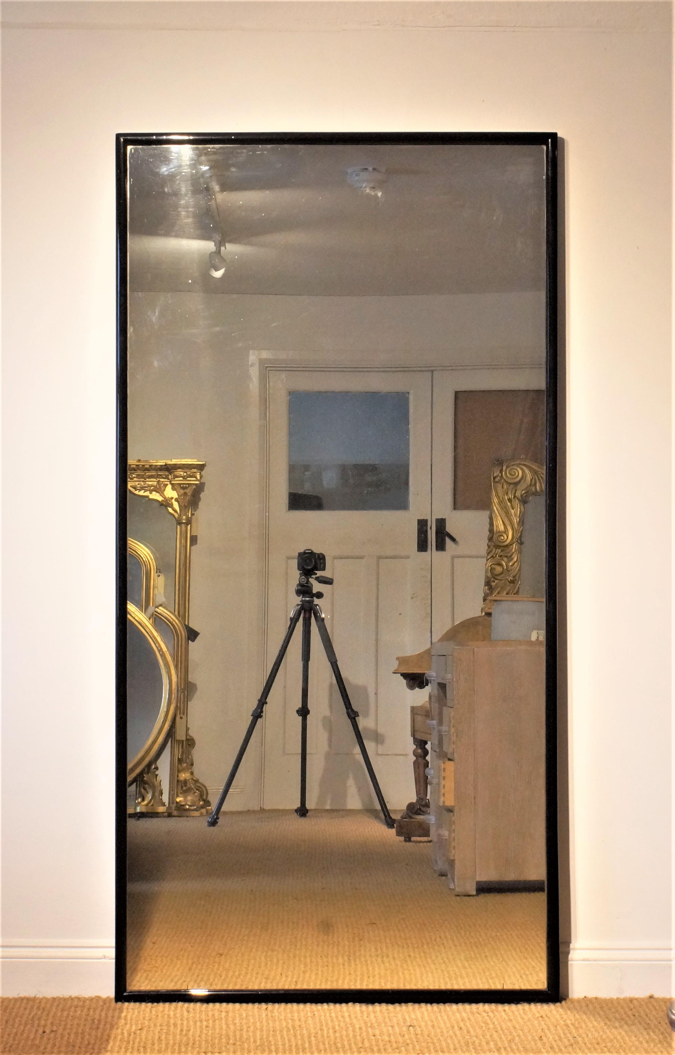 Of superb scale this mirror retains its original glass plate and panelled back.
It can be hung portrait or landscape over a console, sofa or hall table or simply stood on floor as a dressing mirror.
   