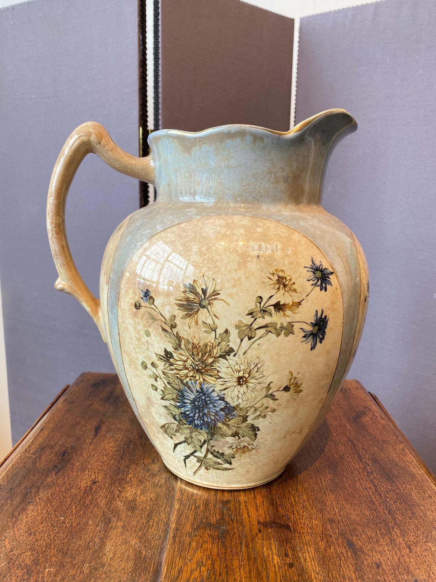 Late 19th century Royce ironstone transferware pitcher with floral motif.