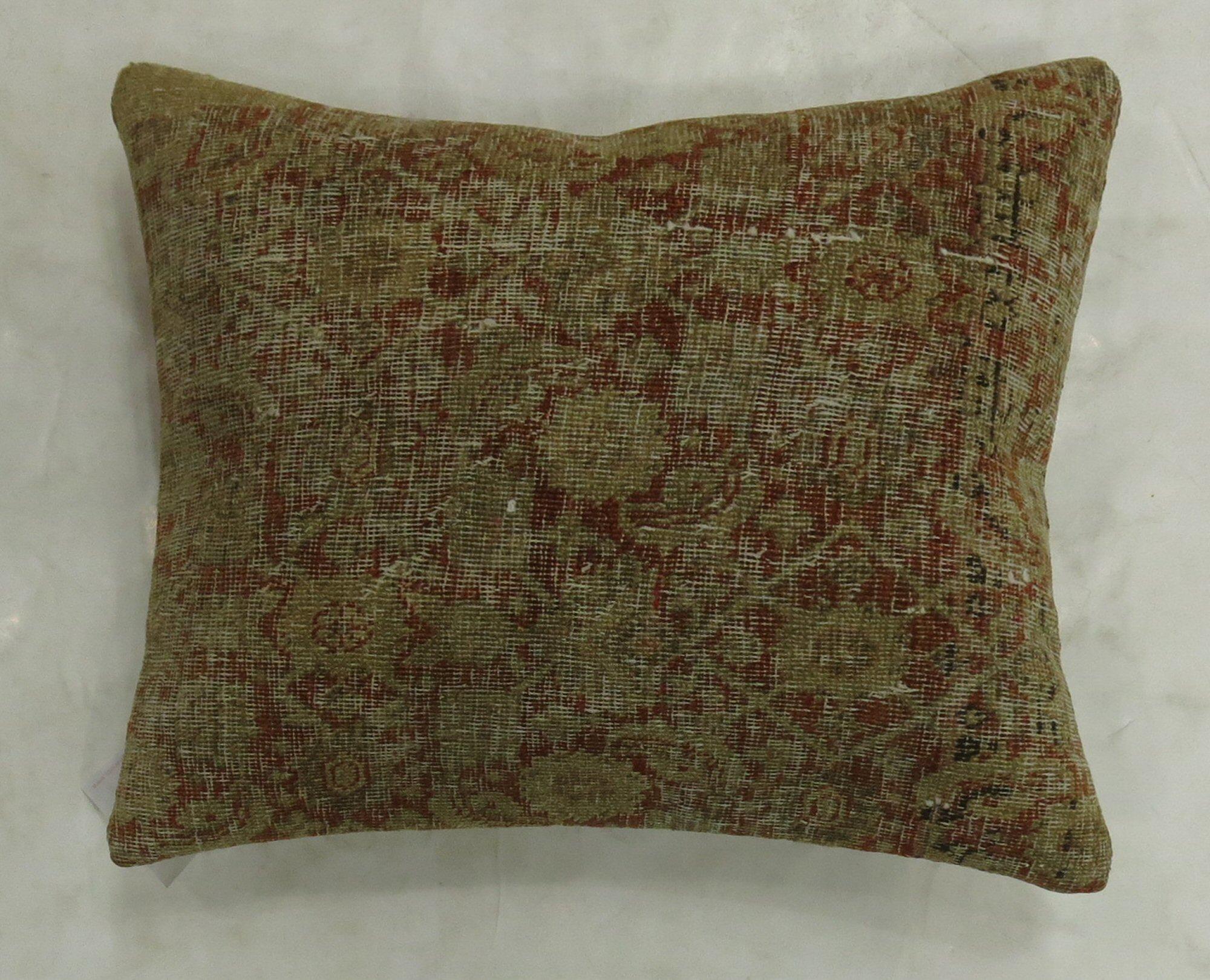 Pillow made from a 19th century fine quality Persian Tabriz rug featuring a Herati design on a rusty red ground. 
Measures: 16
