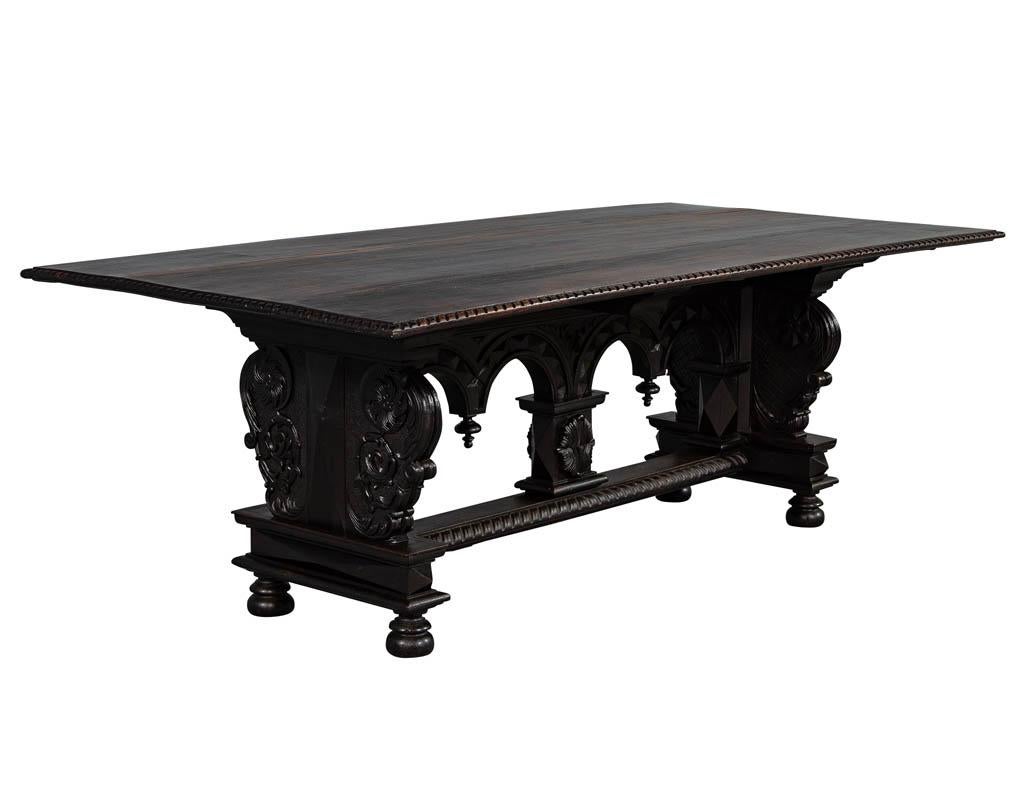 Rustic French carved dining table. Featuring hand carved base and original plank tabletop.