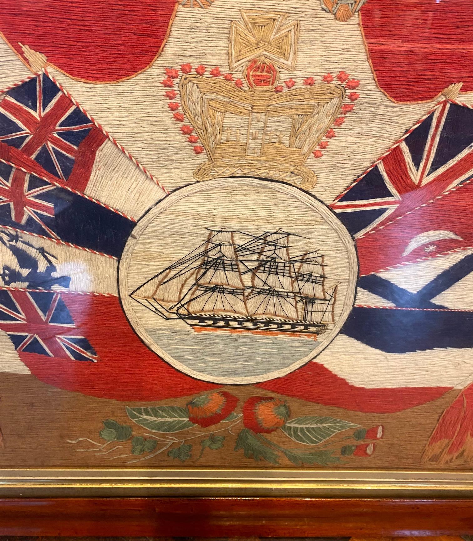 Late 19th century Sailor's Woolwork with Ship and Array of Flags, circa 1899, a classic and pretty sophisticated folk art woolie with a Ship under full sail, presented in a reserve beneath a crown and flanked by an array of the flags of Western
