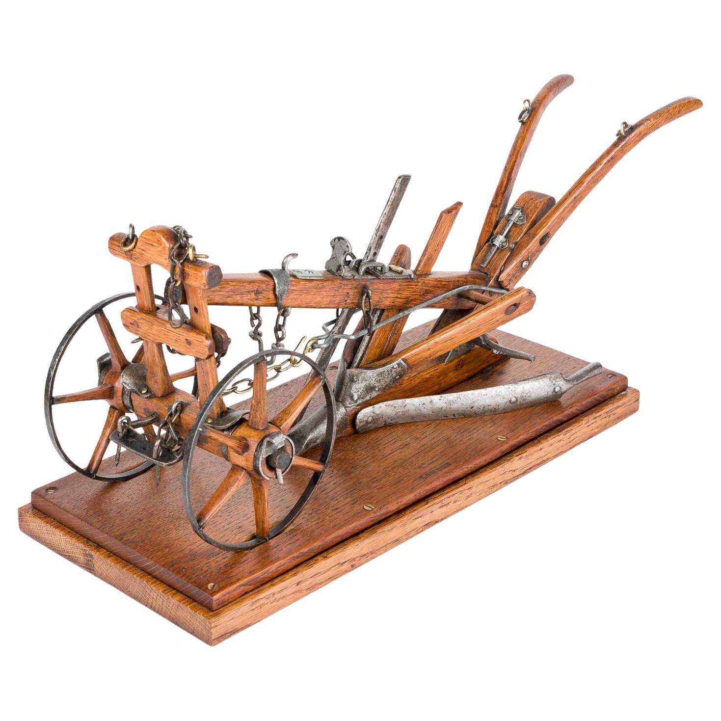 Late 19th century scale model of a horse drawn single farrow plough