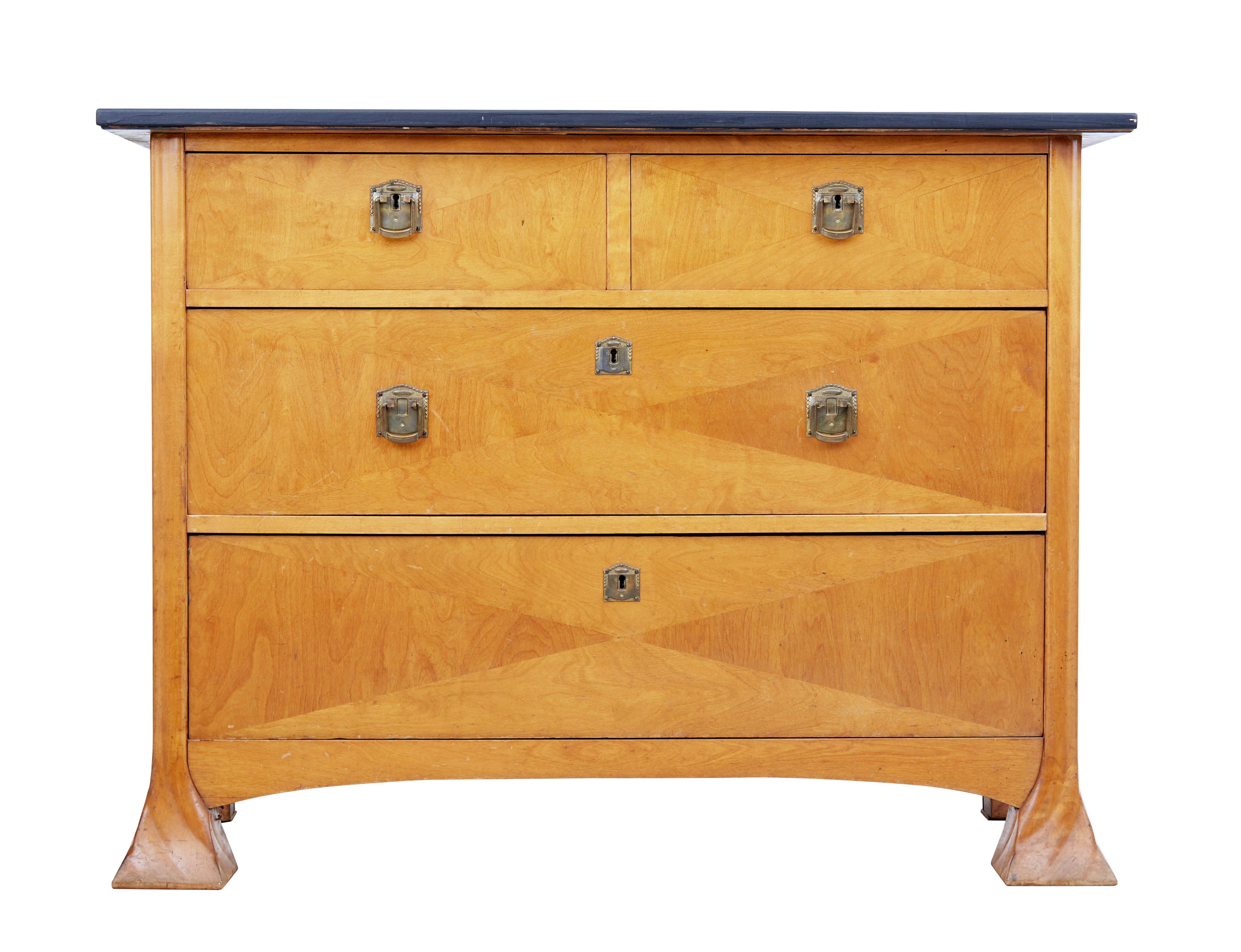 Unusual Art Nouveau Swedish chest of drawers, circa 1890.

2 over 2 drawers with original handles and escutheons. Original top which has since been sanded and ebonised. Unusual splayed and twisted feet.

Birch veneer drawer fronts arranged into